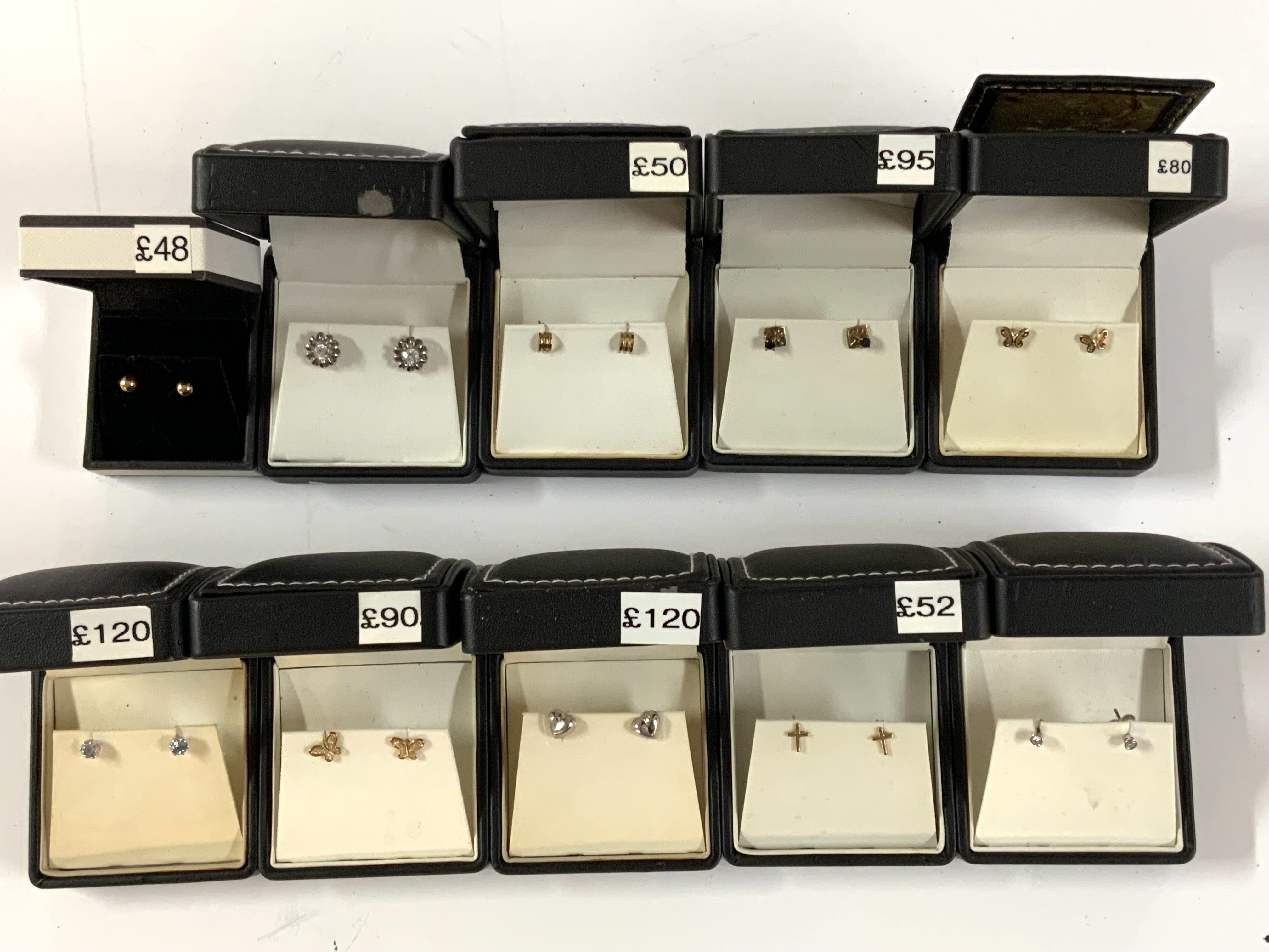 10 pairs of 9ct gold and stone set stud earrings. (A)