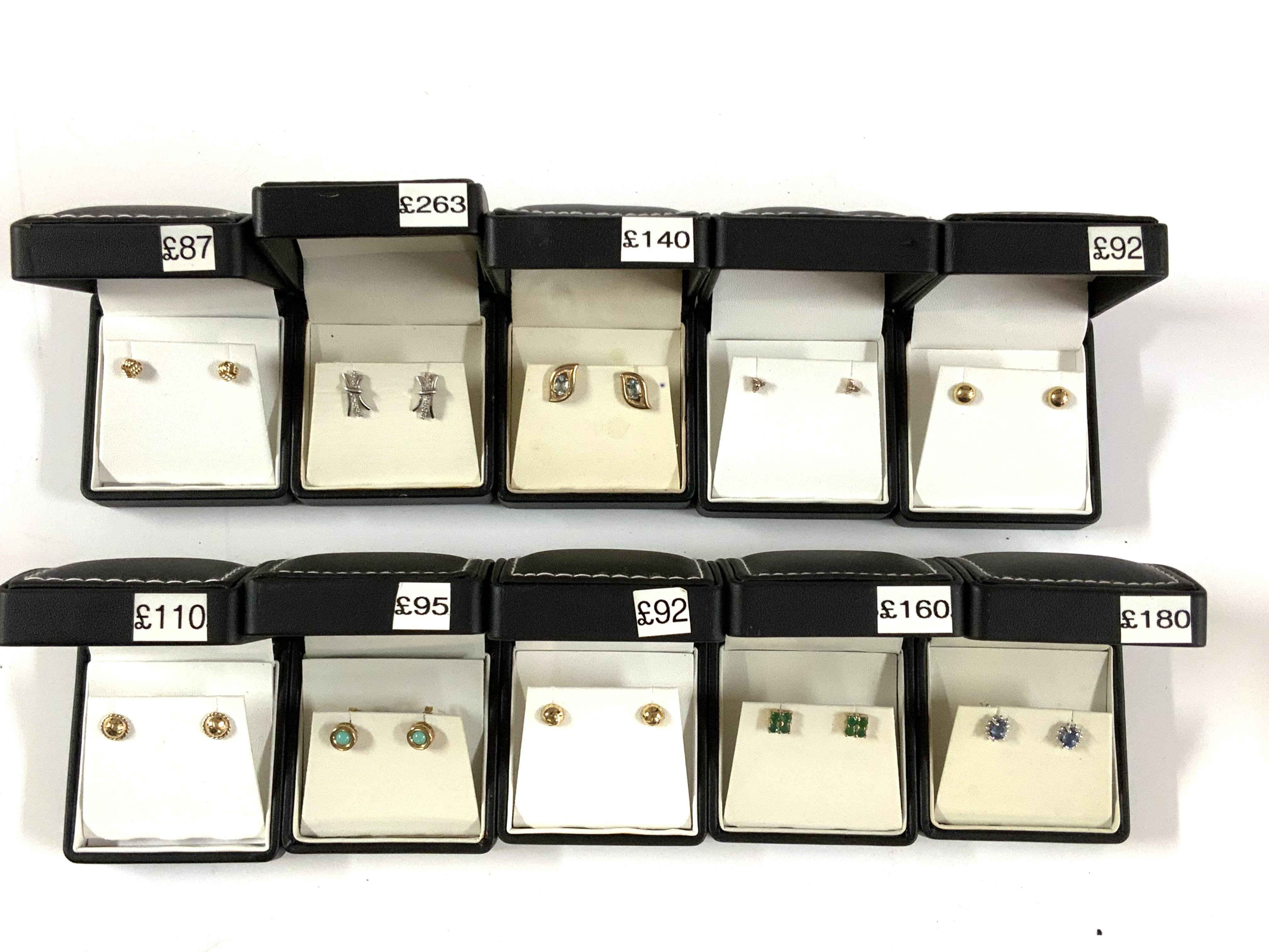 10 pairs of 9ct gold stone set stud earrings.