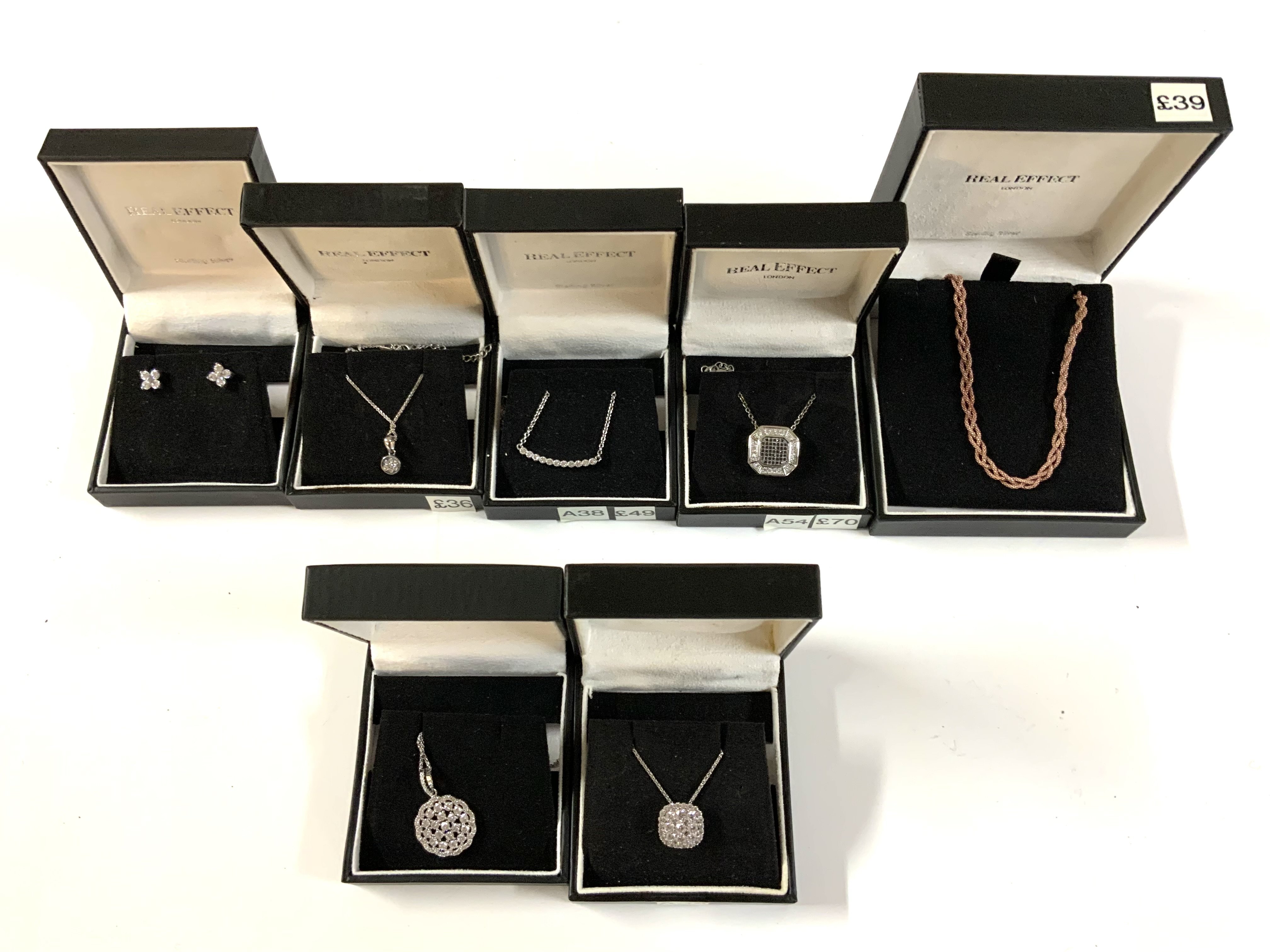 7 Sterling silver and stone set pendants and chains. (A)
