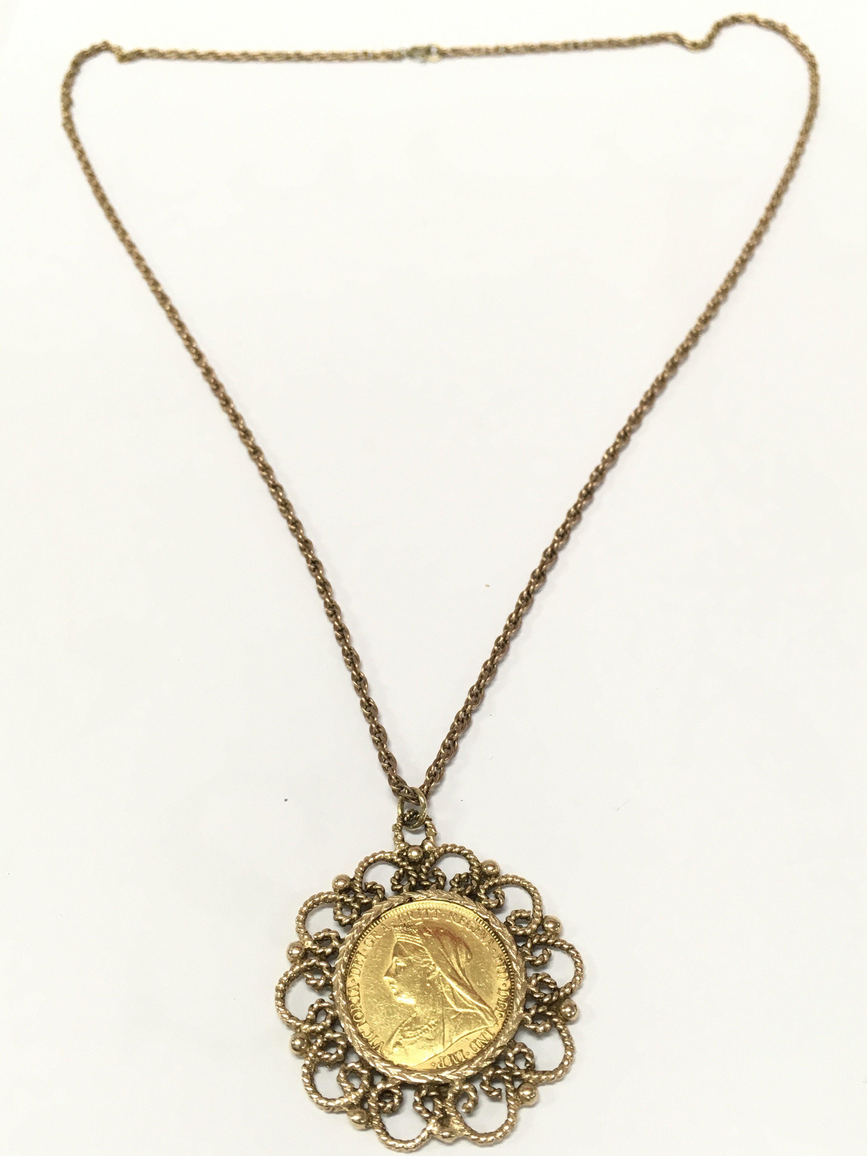 A Victorian sovereign in a 9ct gold mount , 9k marked chain. 23g total weight. Postage category A