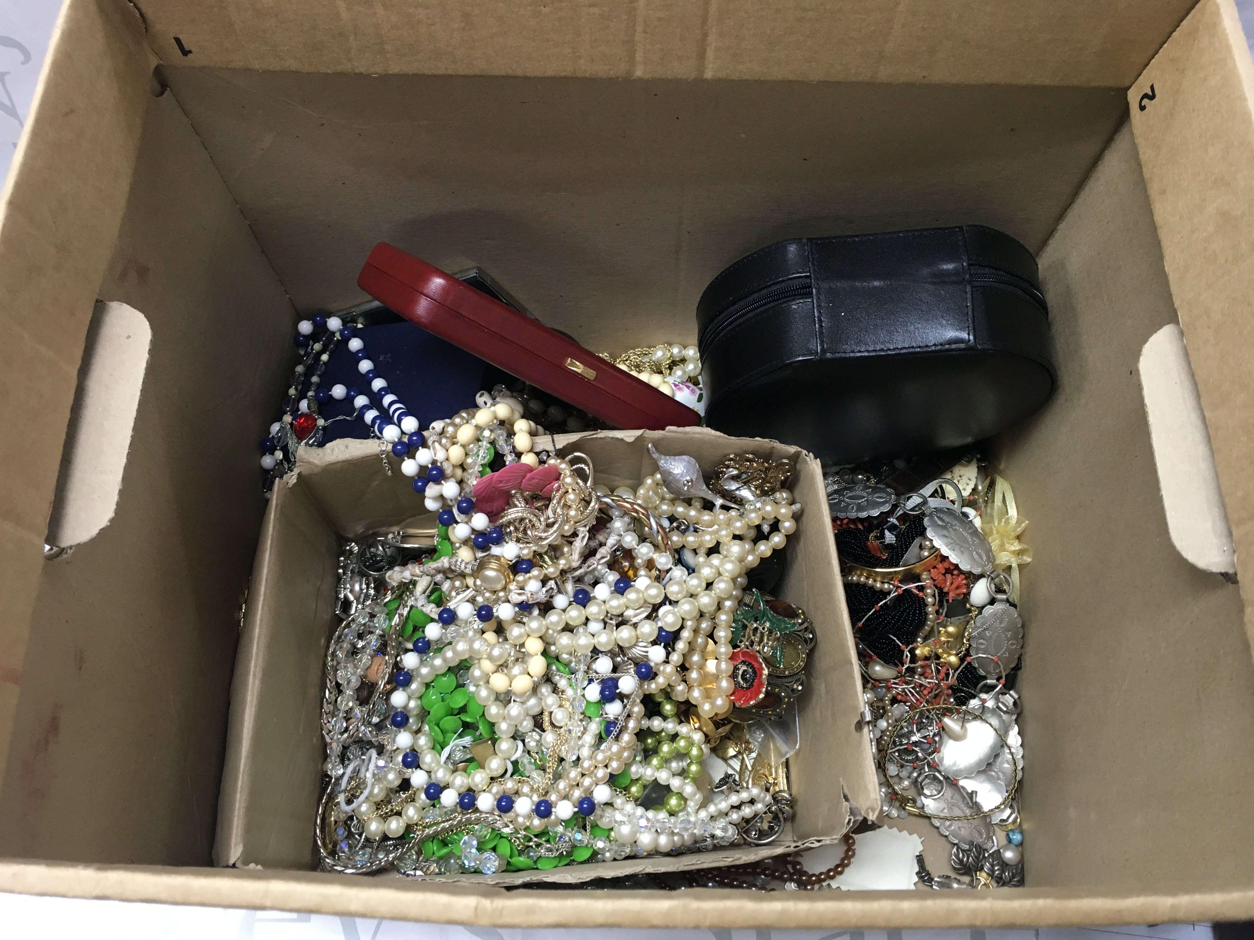 A large box of costume jewellery and costume jewellery boxes.