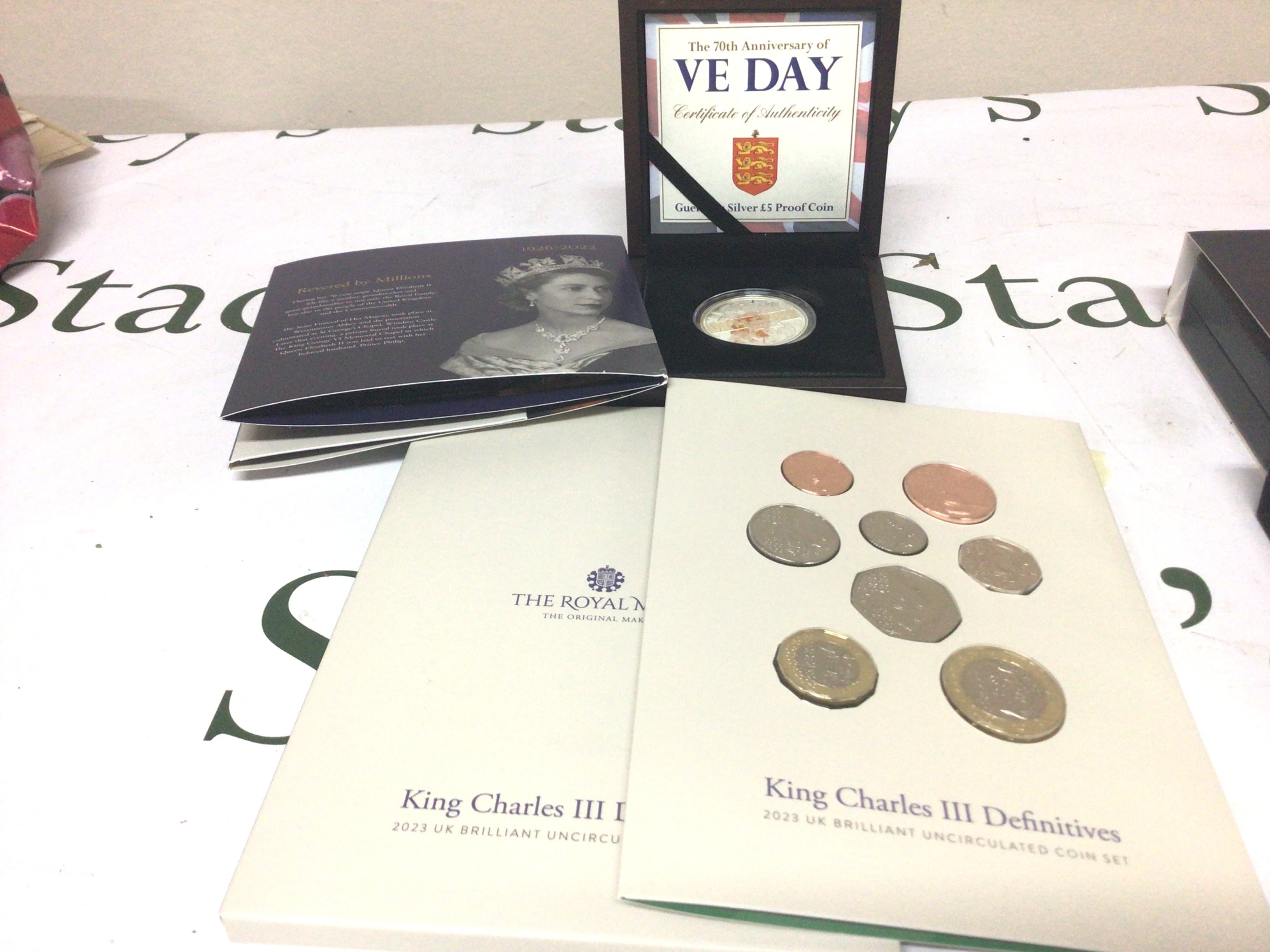 A Silver proof Five pound coin VE Day a set of King Charles III definitive coins and one other commemorative coin (3)