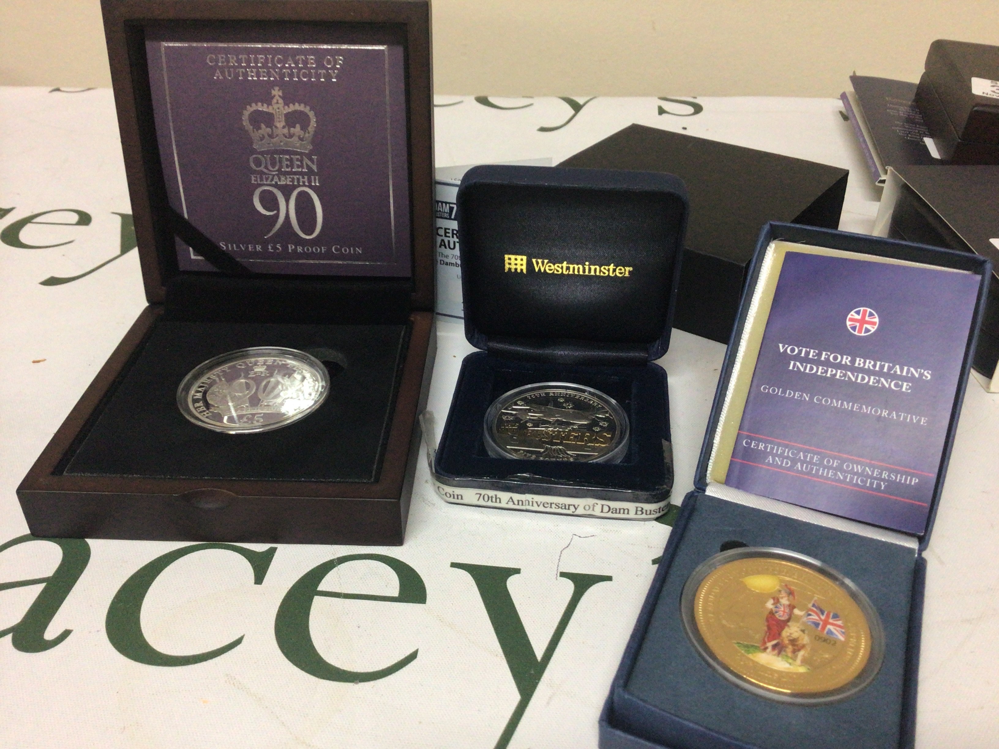 Two Silver Proof Five pound coins The Dambusters 70th Anniversary Queen Elizabeth II 90th birthday coin and gold plated coin 23 June 2016 The Landmark of British independence.
