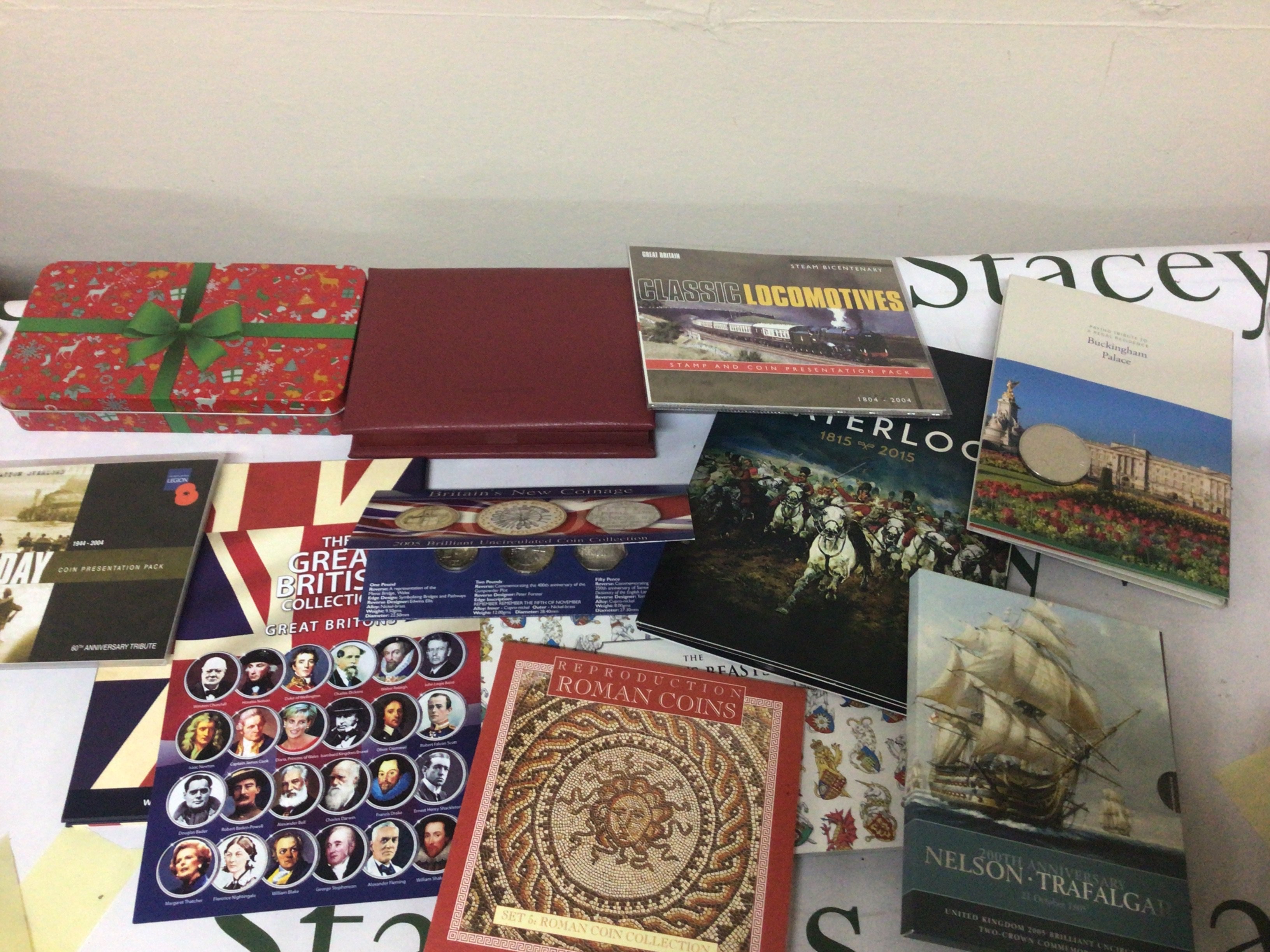 A collection of commemorative coins in presentation packs Nelson Trafalgar Waterloo The Querns Beast The Great British collection retrospective Roman coins and others.