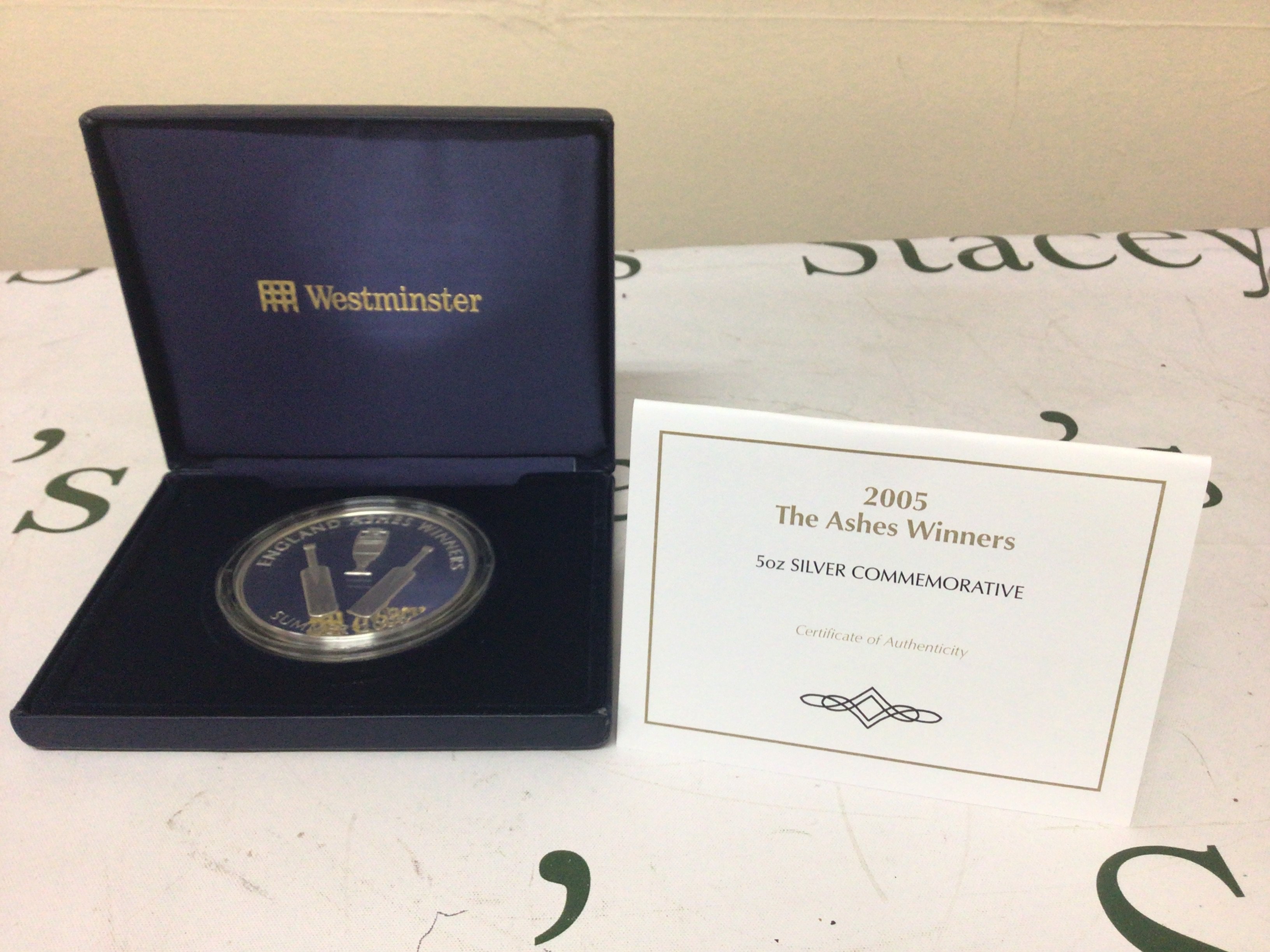 A silver Five Ounce 2005 Commemorative The Ashes Winners in a fitted case with certificate of authenticity.