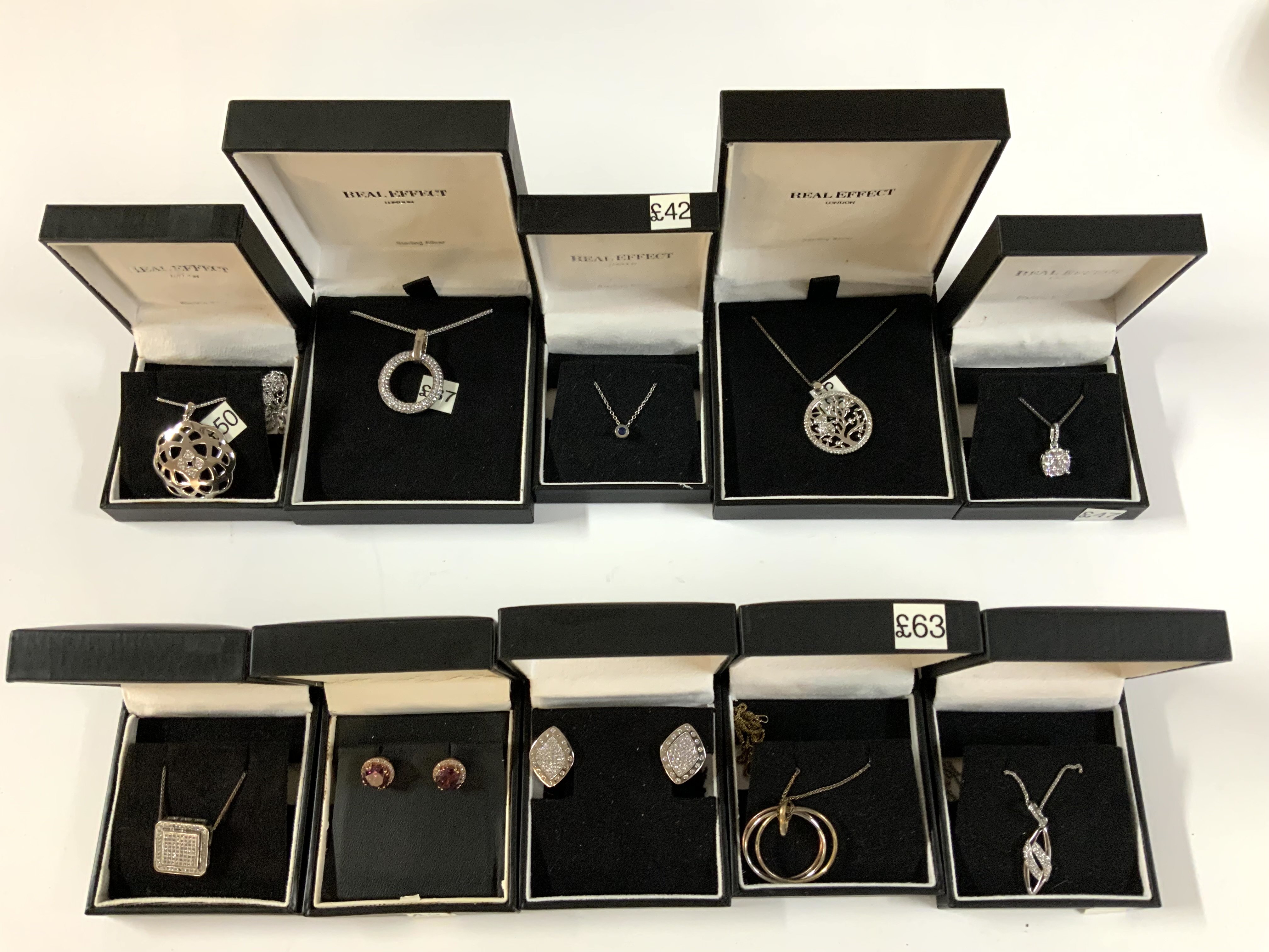 10 Real effect sterling silver and stone set pendants. (A)