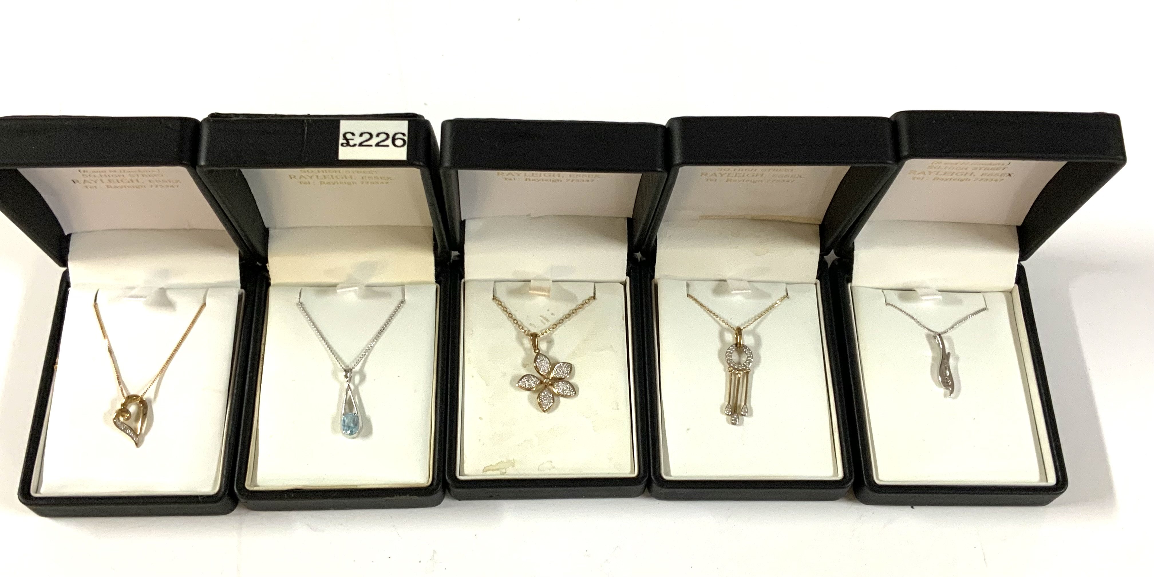 5 9ct gold stone set pendants and chains. (A)