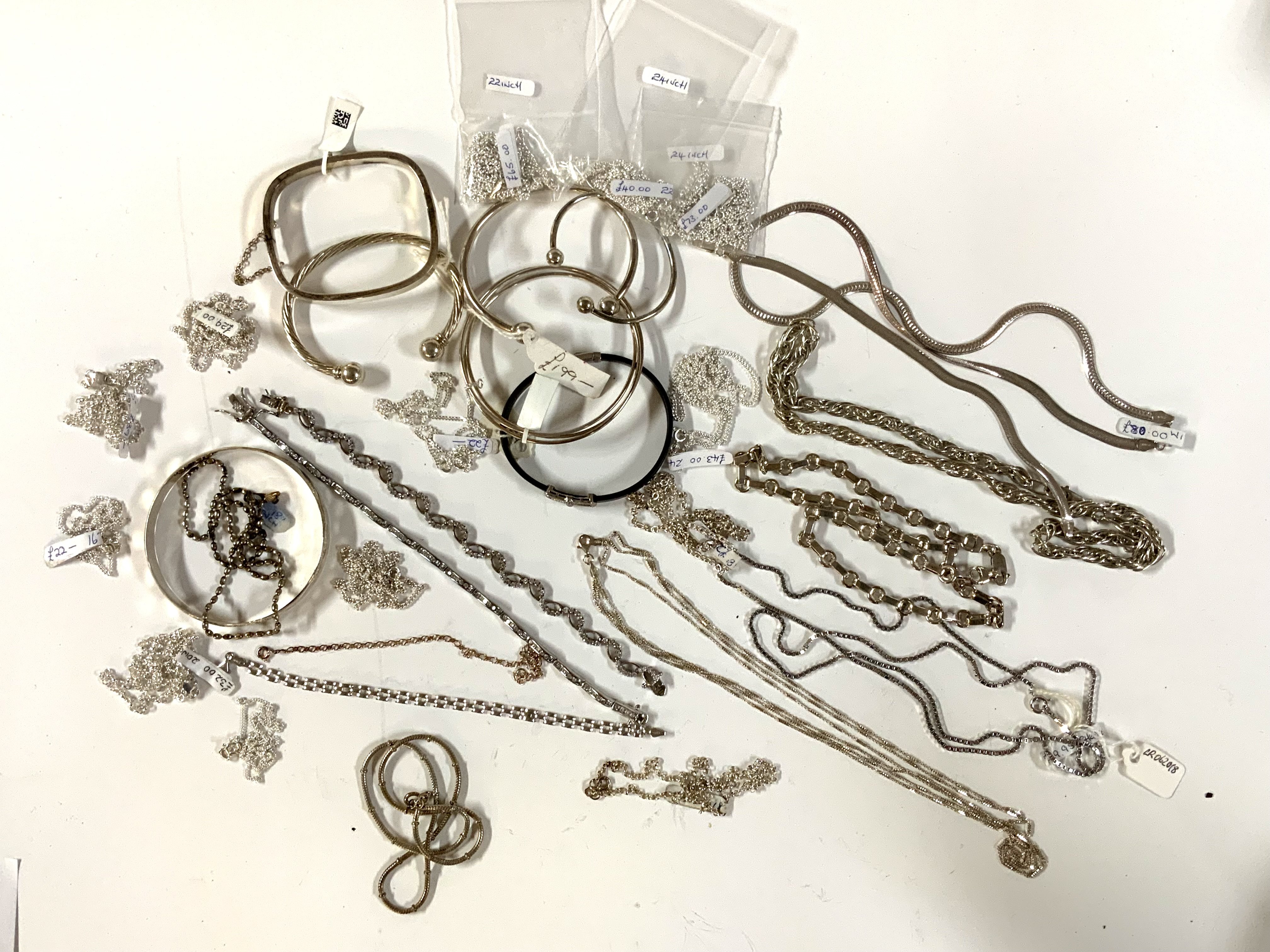 A large collection of sterling silver chains / bracelets and bangles. (A)