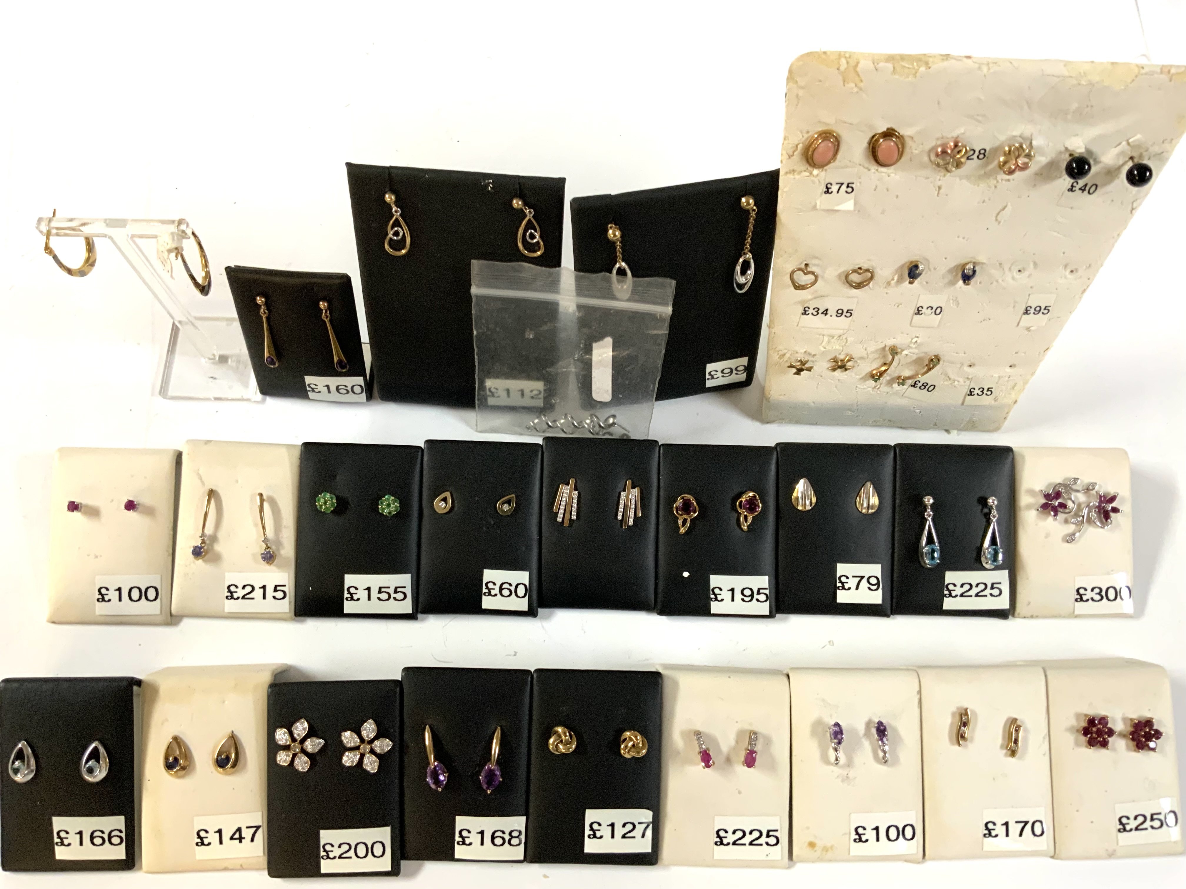 29 pairs of 9ct gold and stone set studs.