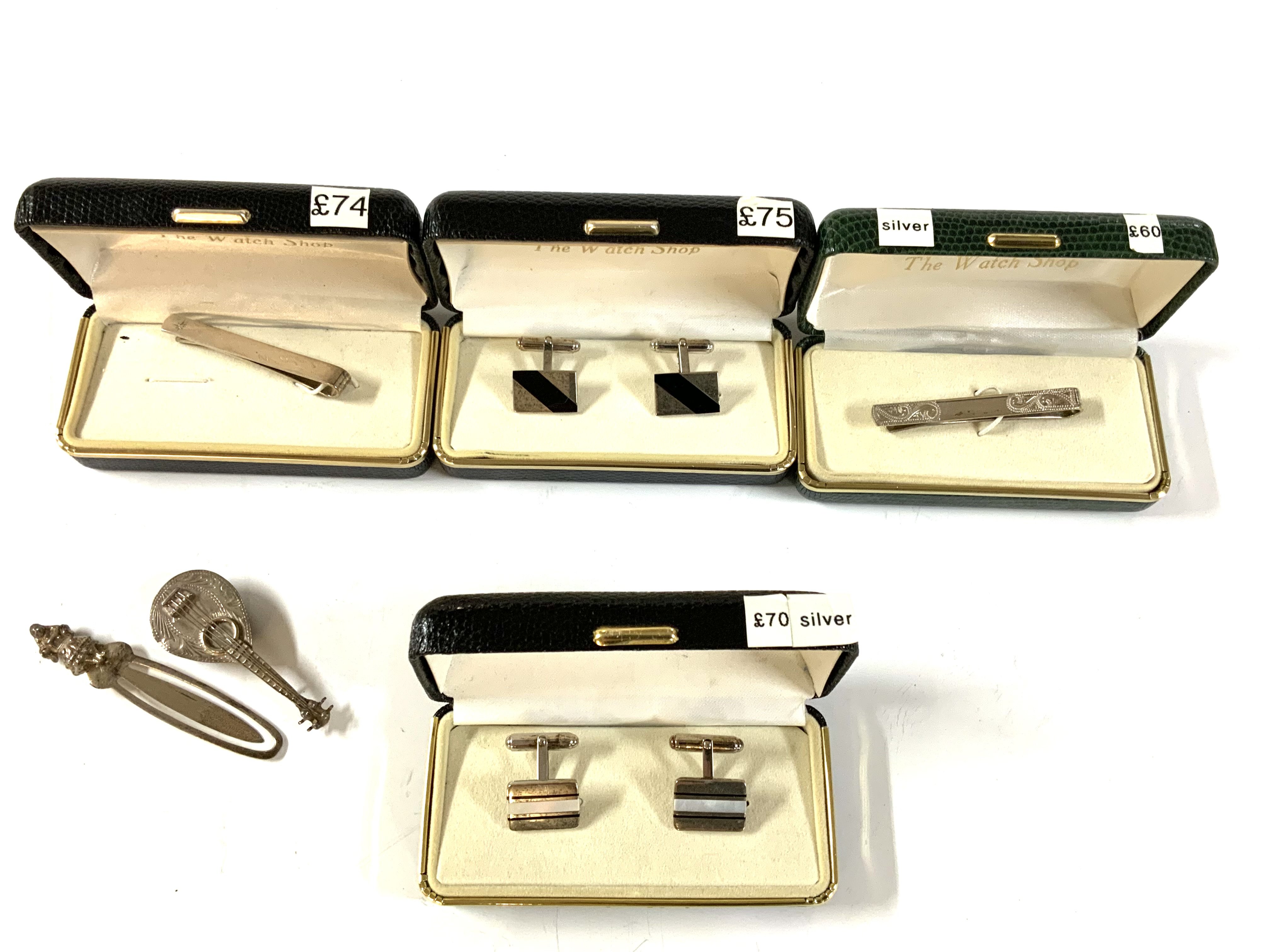 A small collection of hallmarked silver cufflinks, tie pins etc..