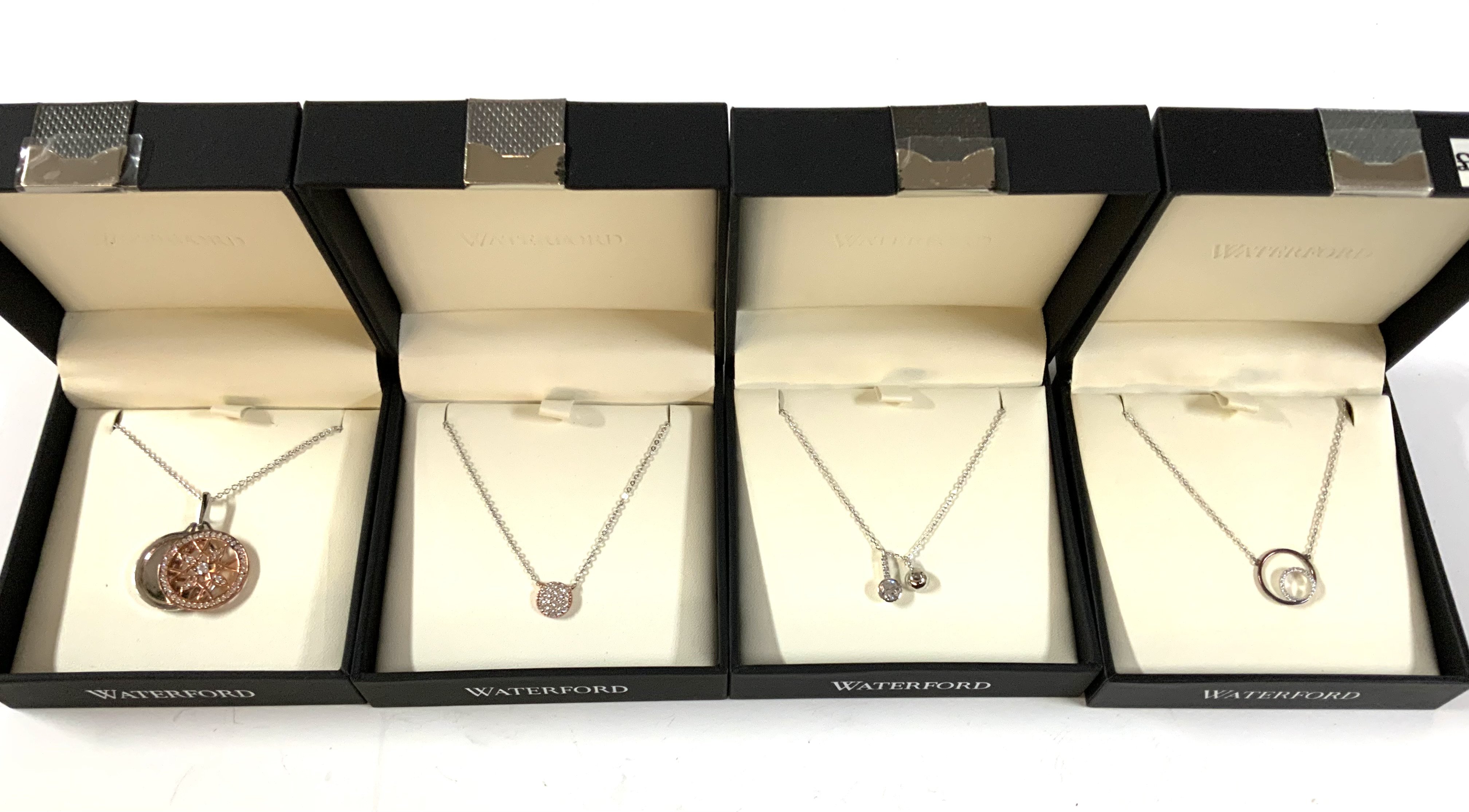 4 Waterford design pendants necklaces.