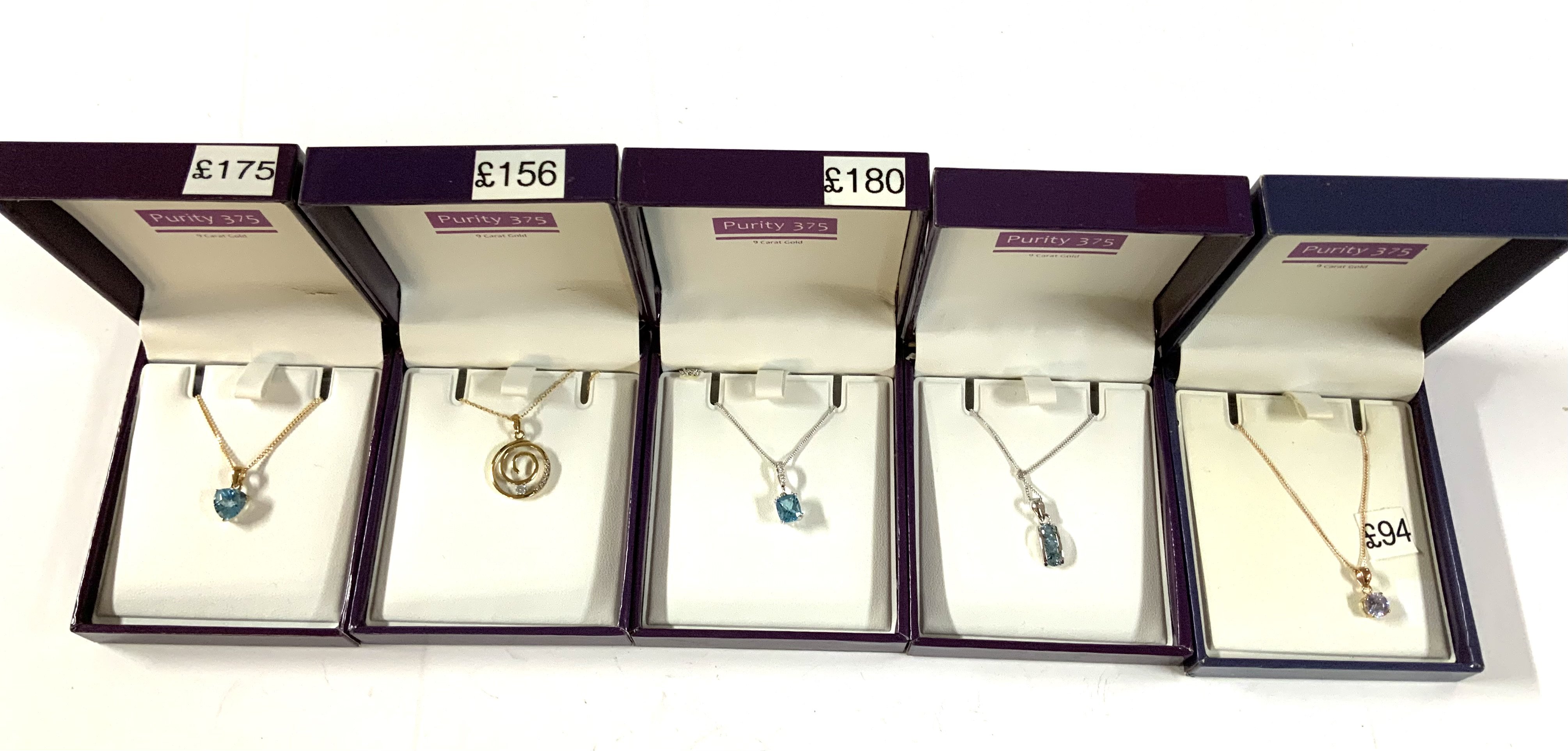 5 9ct gold (Purity 375) pendants and chains.