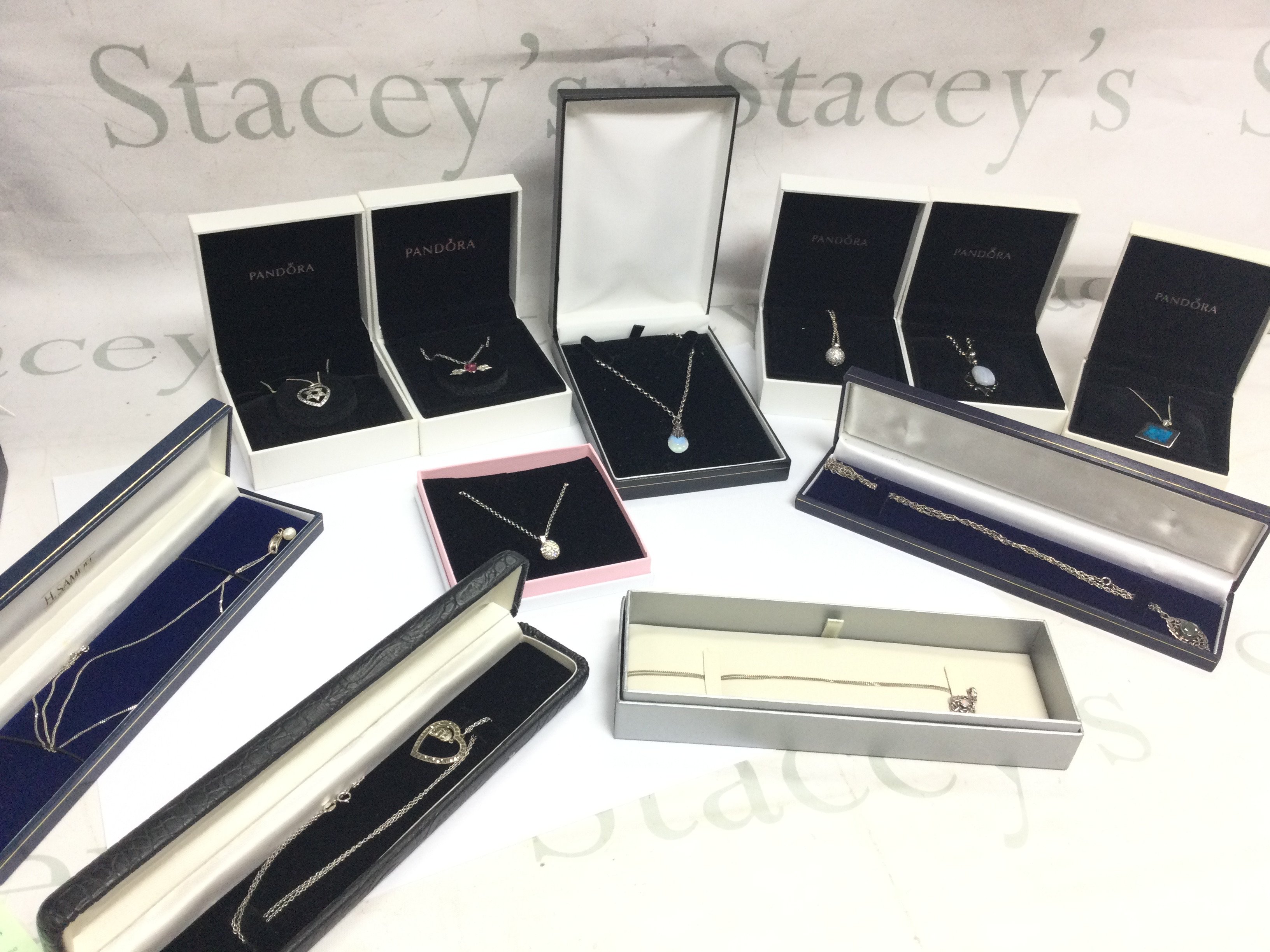 Eleven boxed ladies necklaces all silver chains . Postage category B