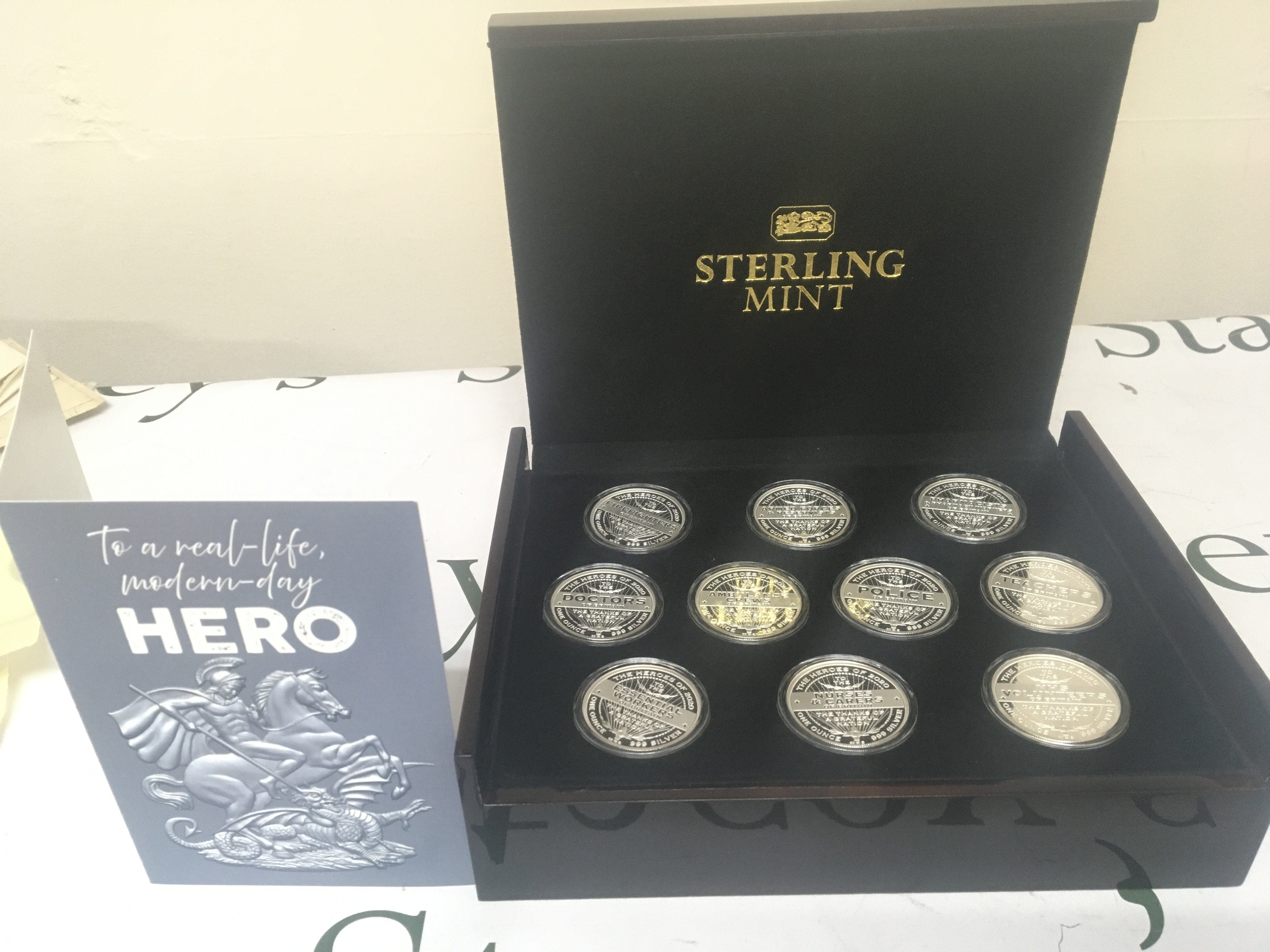 A case containing a Celebration of Hero&#2013266057۪s Silver proof one ounce silver coin collection of ten coins Covid 19 coin collection. In a well presented fitted box with card.
