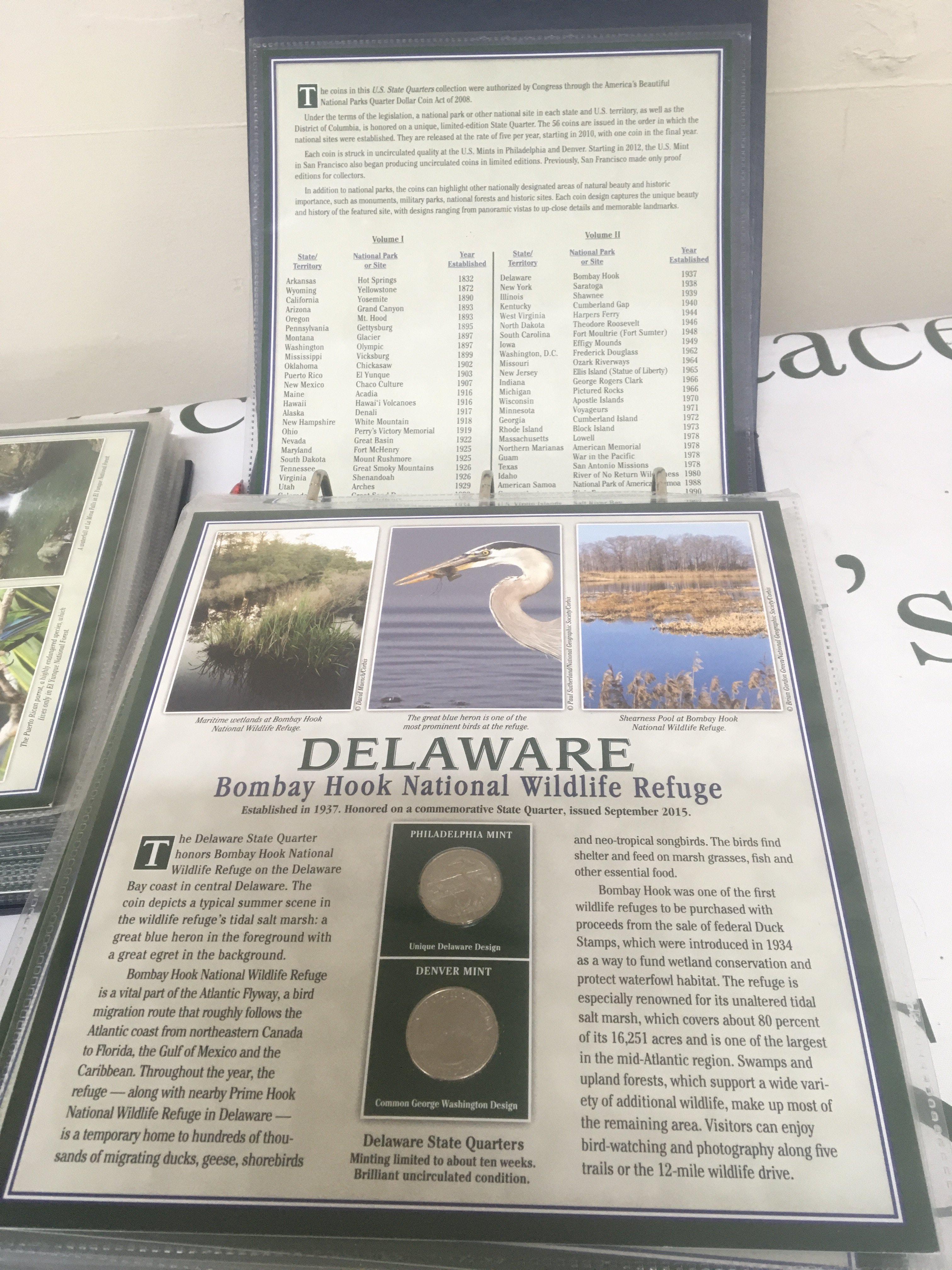 Two comprehensive albums containing American State Quarters the coins set in illustrated and pictorial reference sheets in two well presented albums. (2)