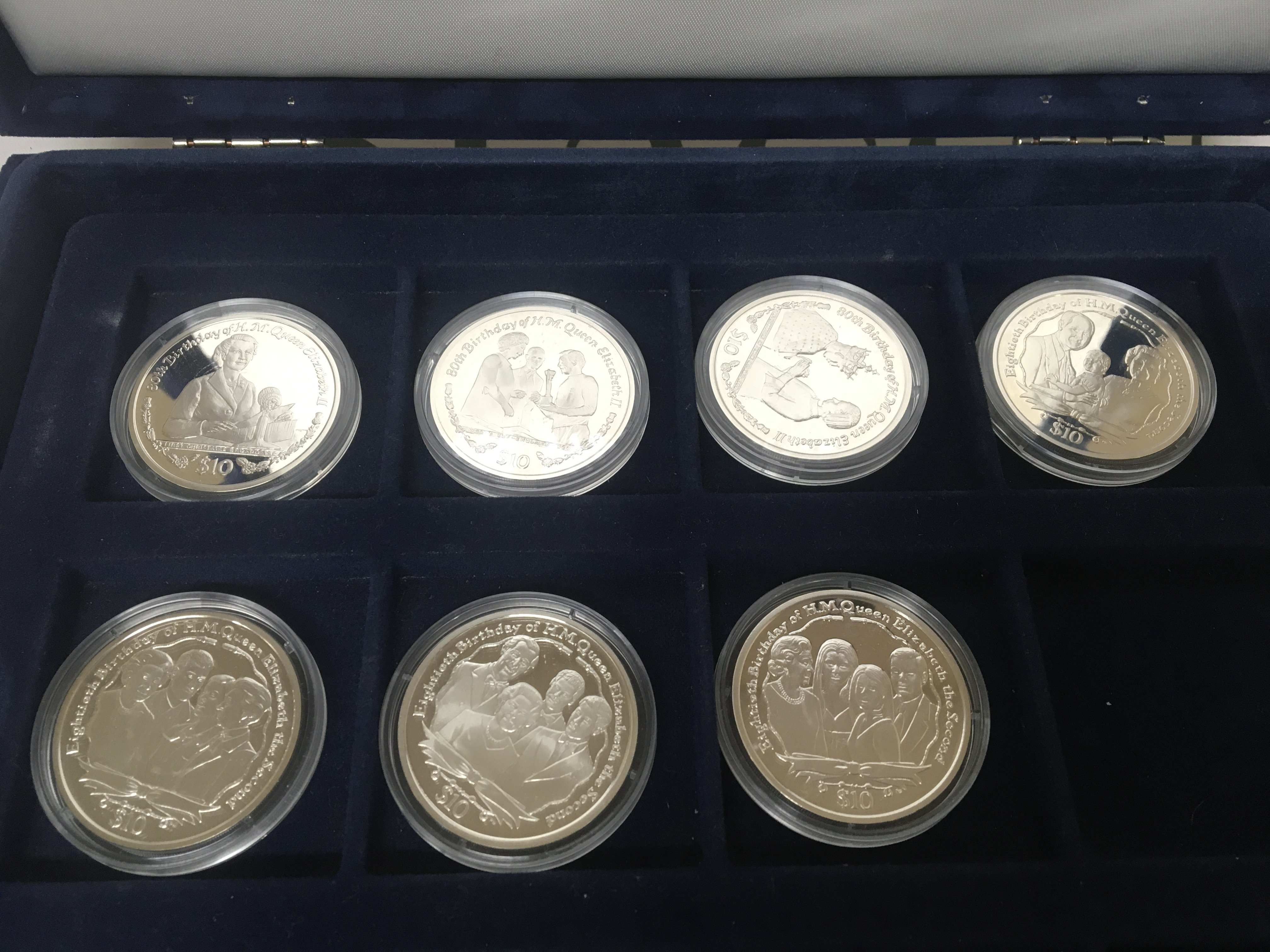 A collection of Silver proof Elizabeth II 80th Birthday collection twenty coins with certificate of authenticity in a fitted box.