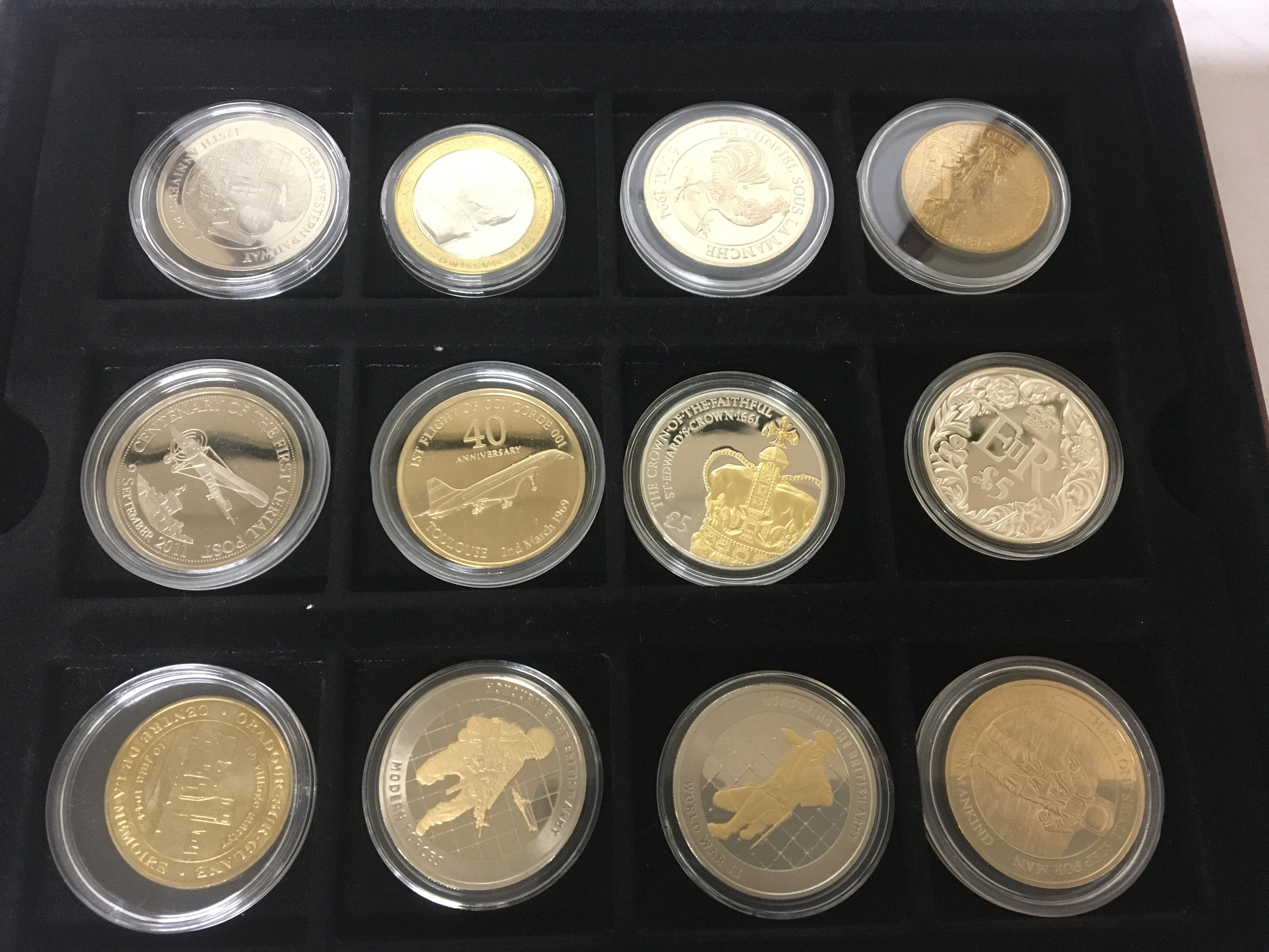 A collection of mixed commemorative coins including some silver proof and gold plated nickel coins.
