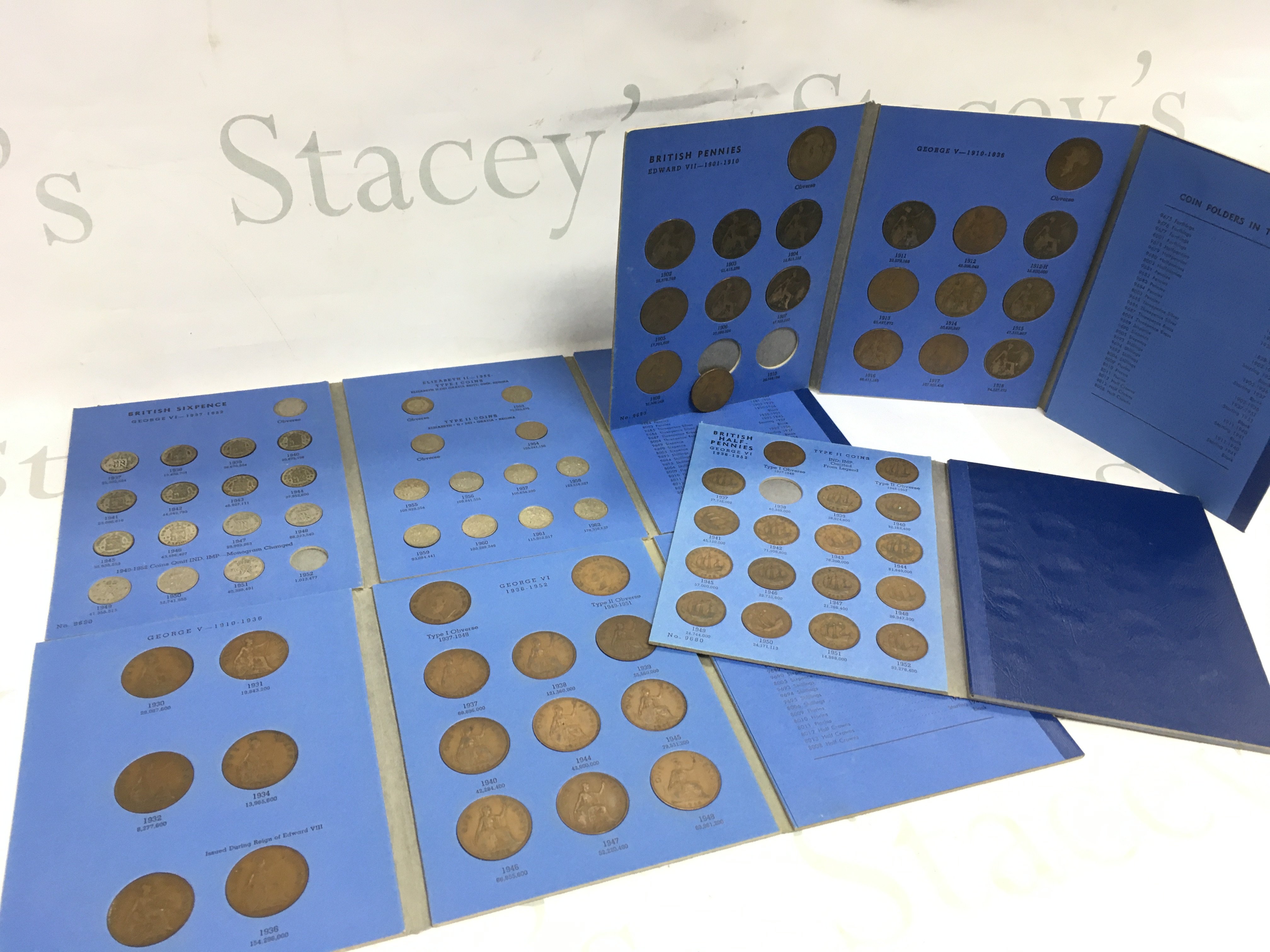 Four blue albums Great British coins , pennies and six pence. Postage category B