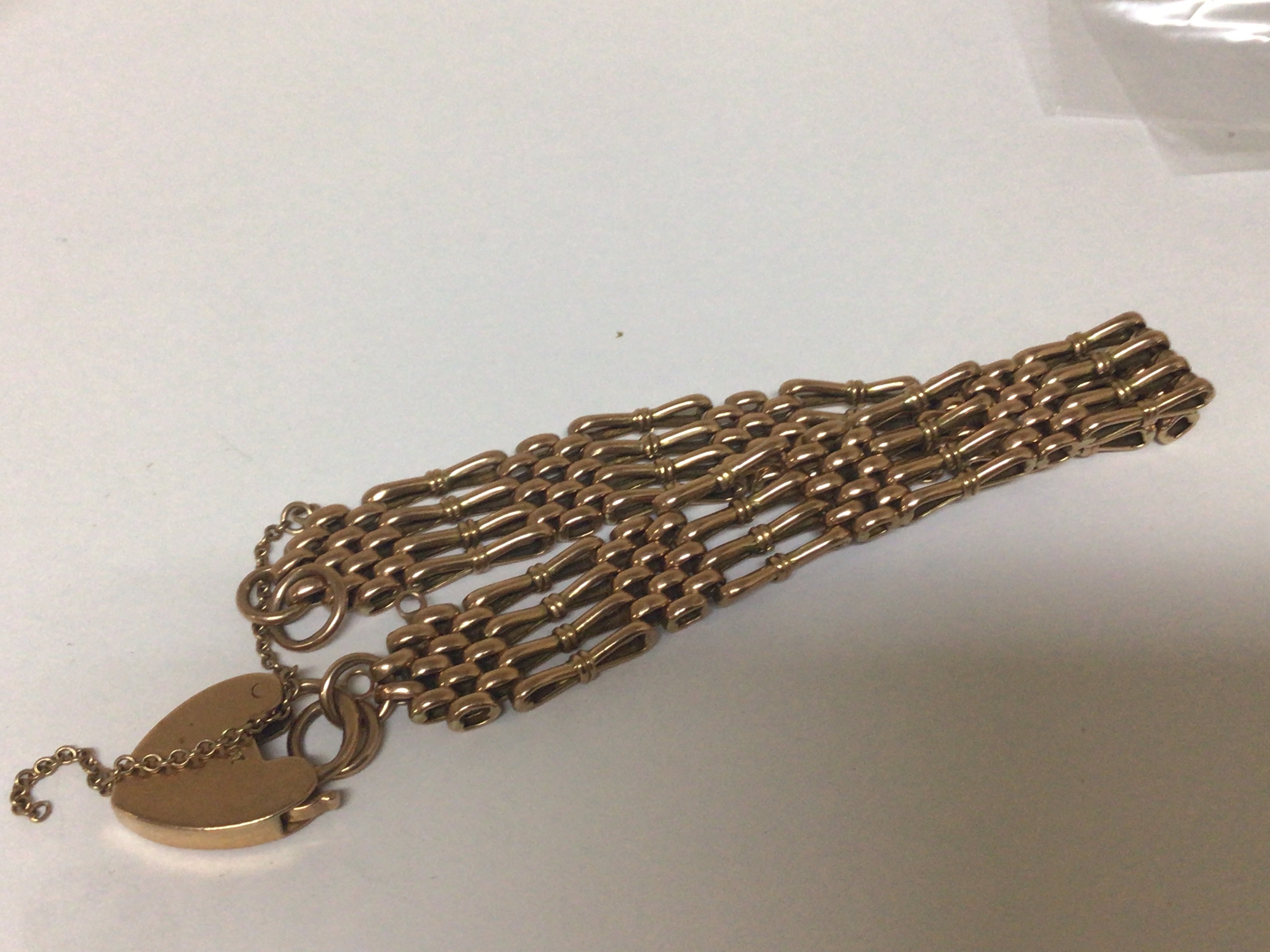 A 9carat gold gate bracelet with a padlock clasp weight 17g