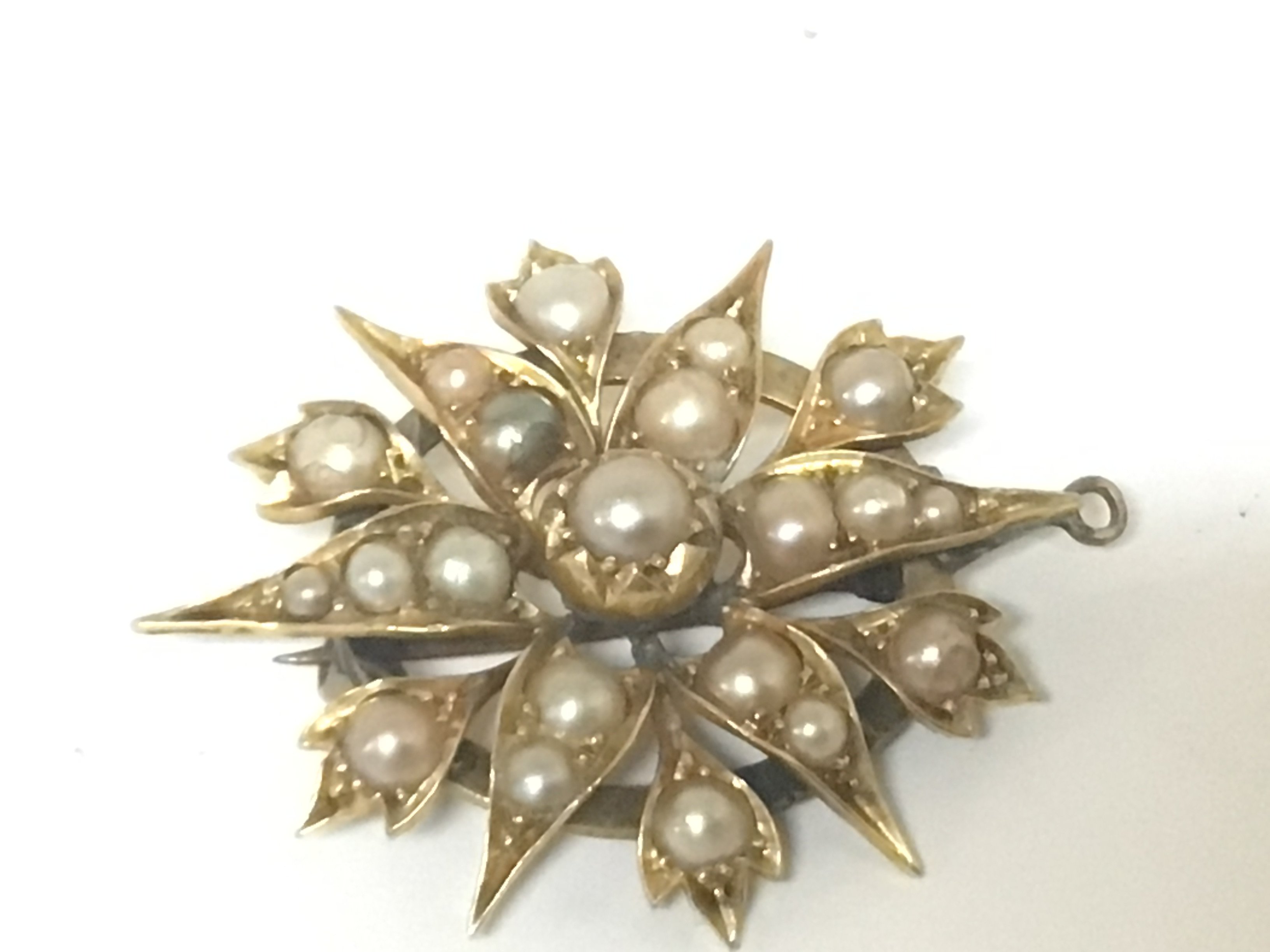 A Pearl set Antique brooch folate star pattern.repaired