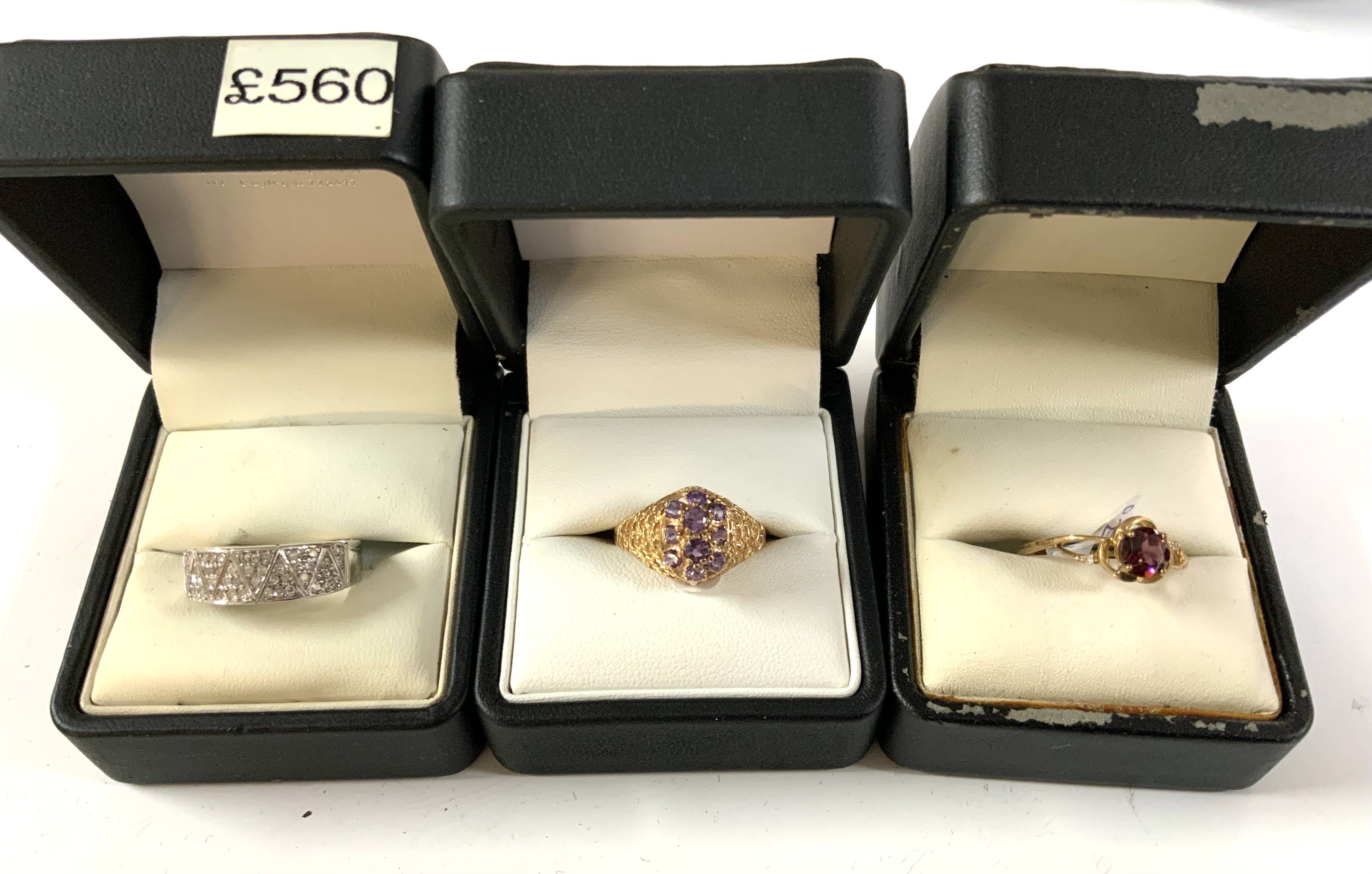 3 9ct gold stone set rings. (A)