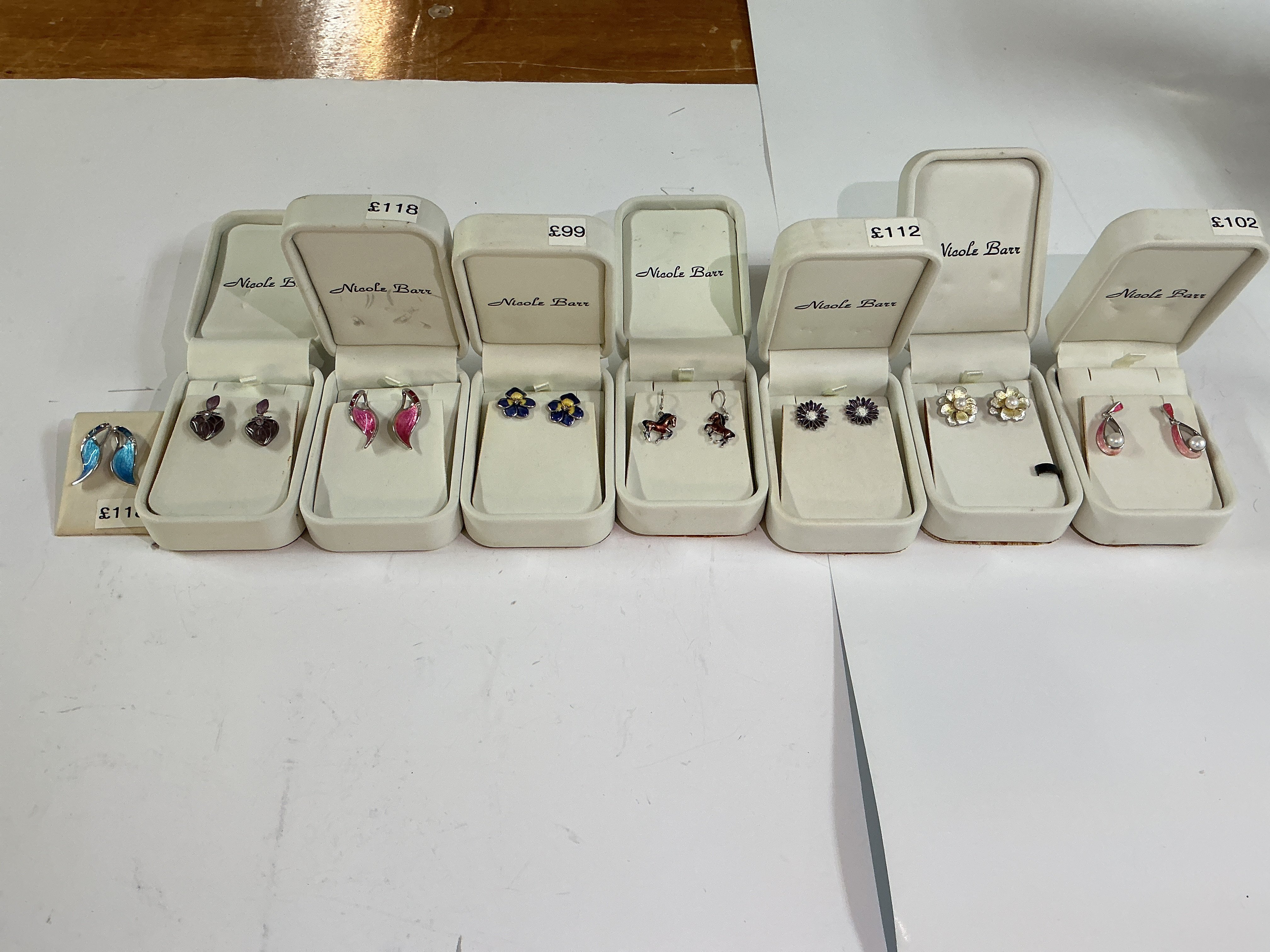 8 pairs of silver enamelled earrings.