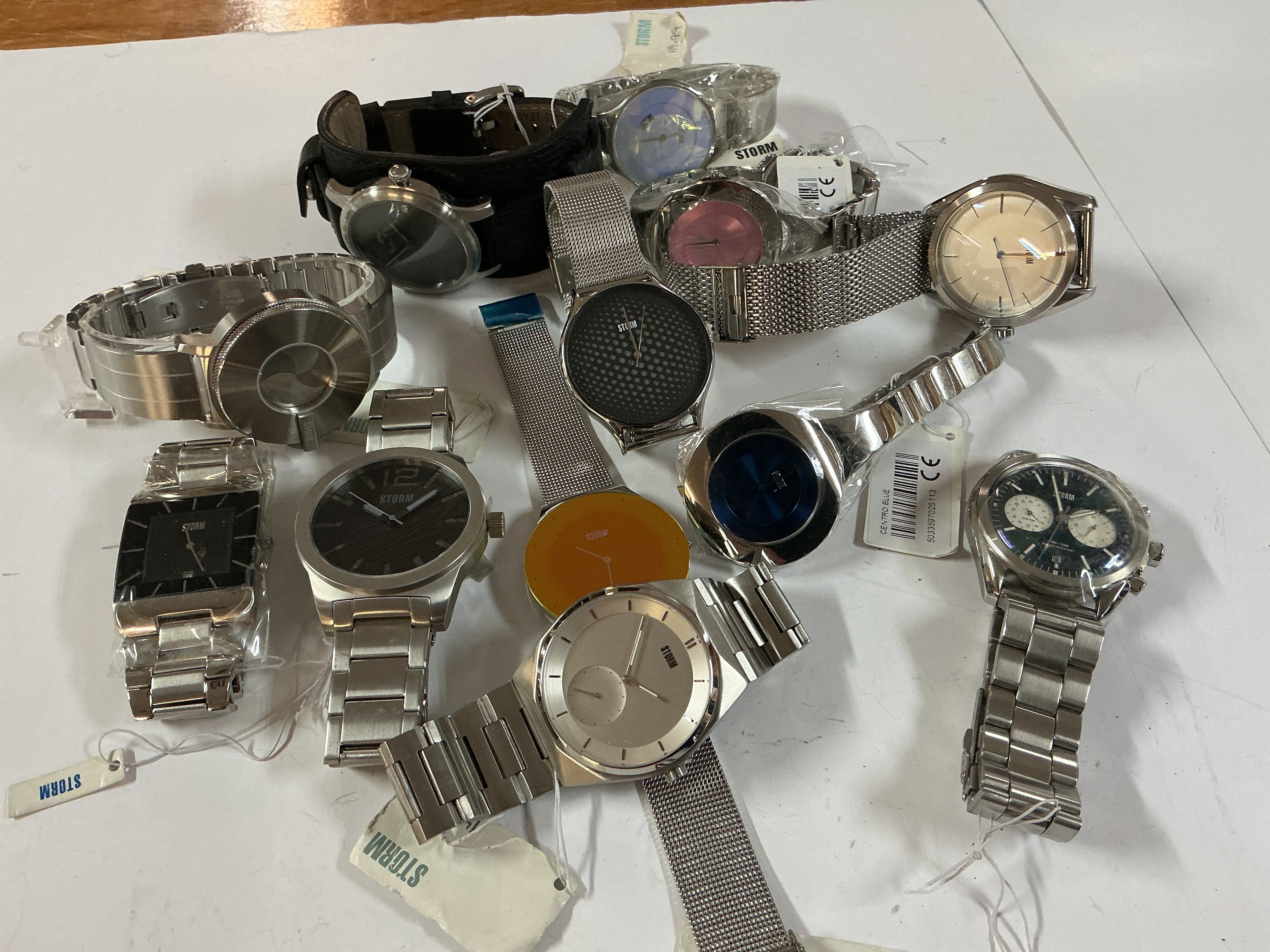 A bag of 12 gents storm watches.