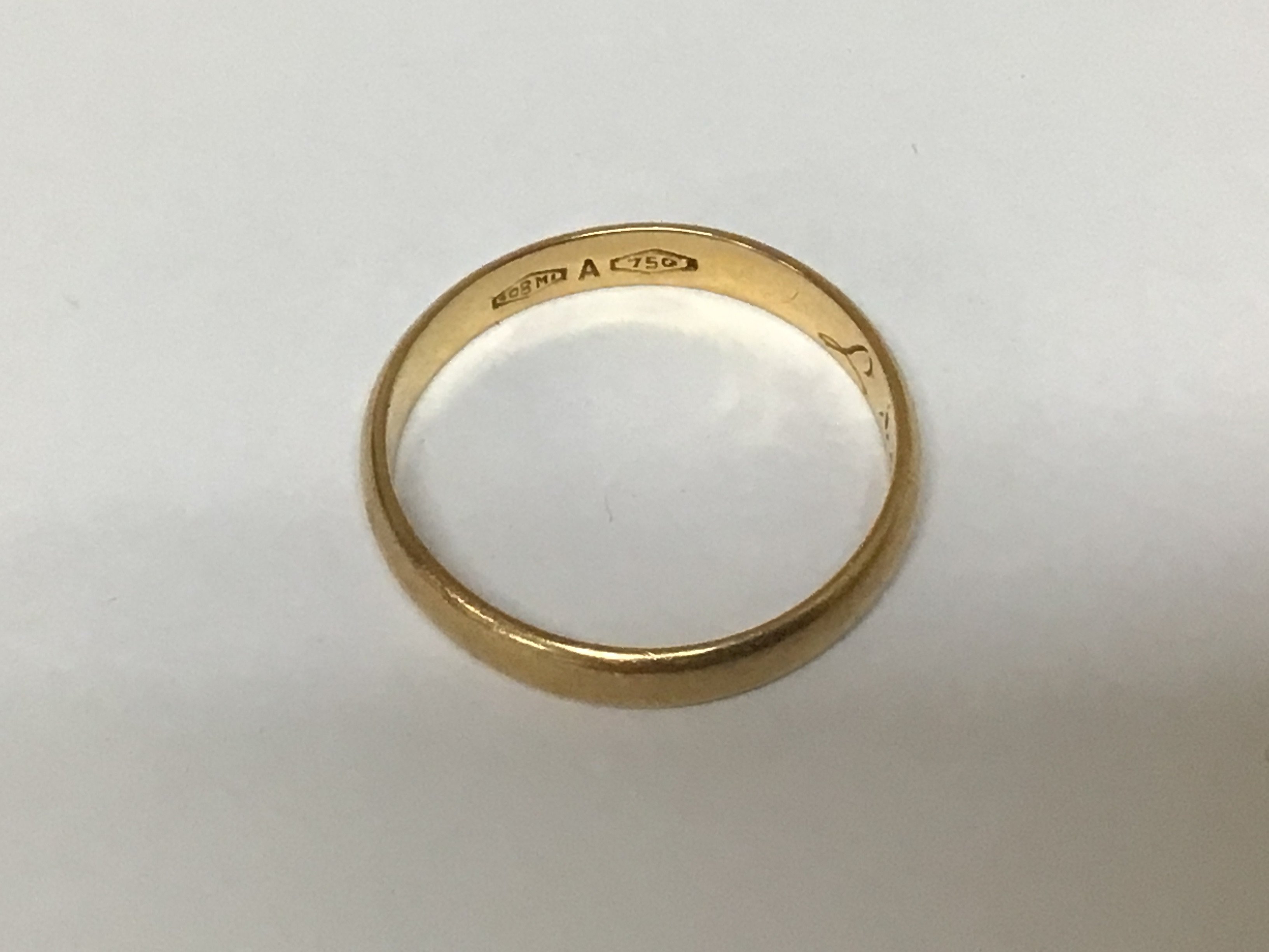 An 18carat gold wedding ring with personal inscription weight 3g