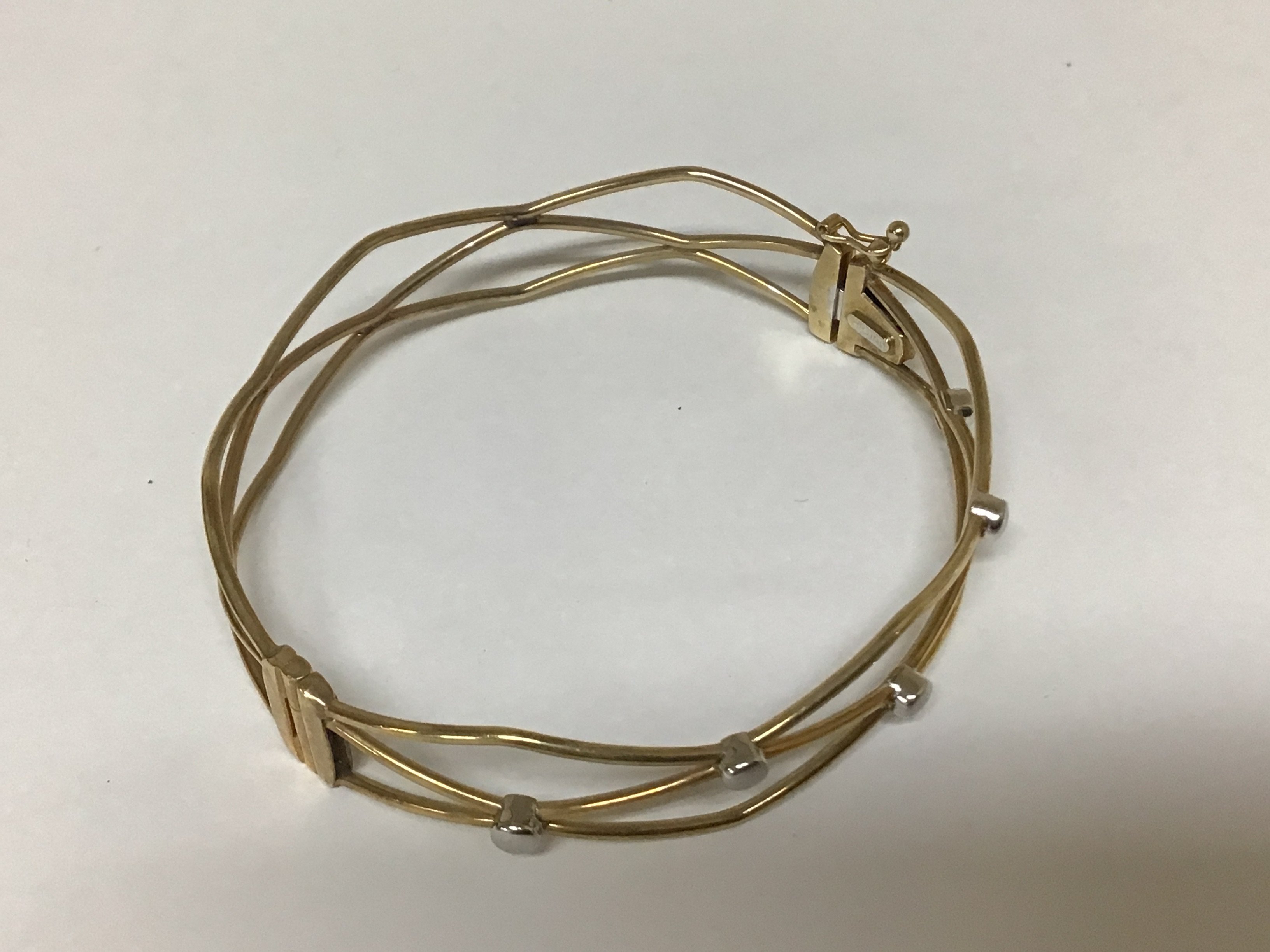 An Italian Modern design 9carat gold bracelet open link with white gold studs. 8.5g