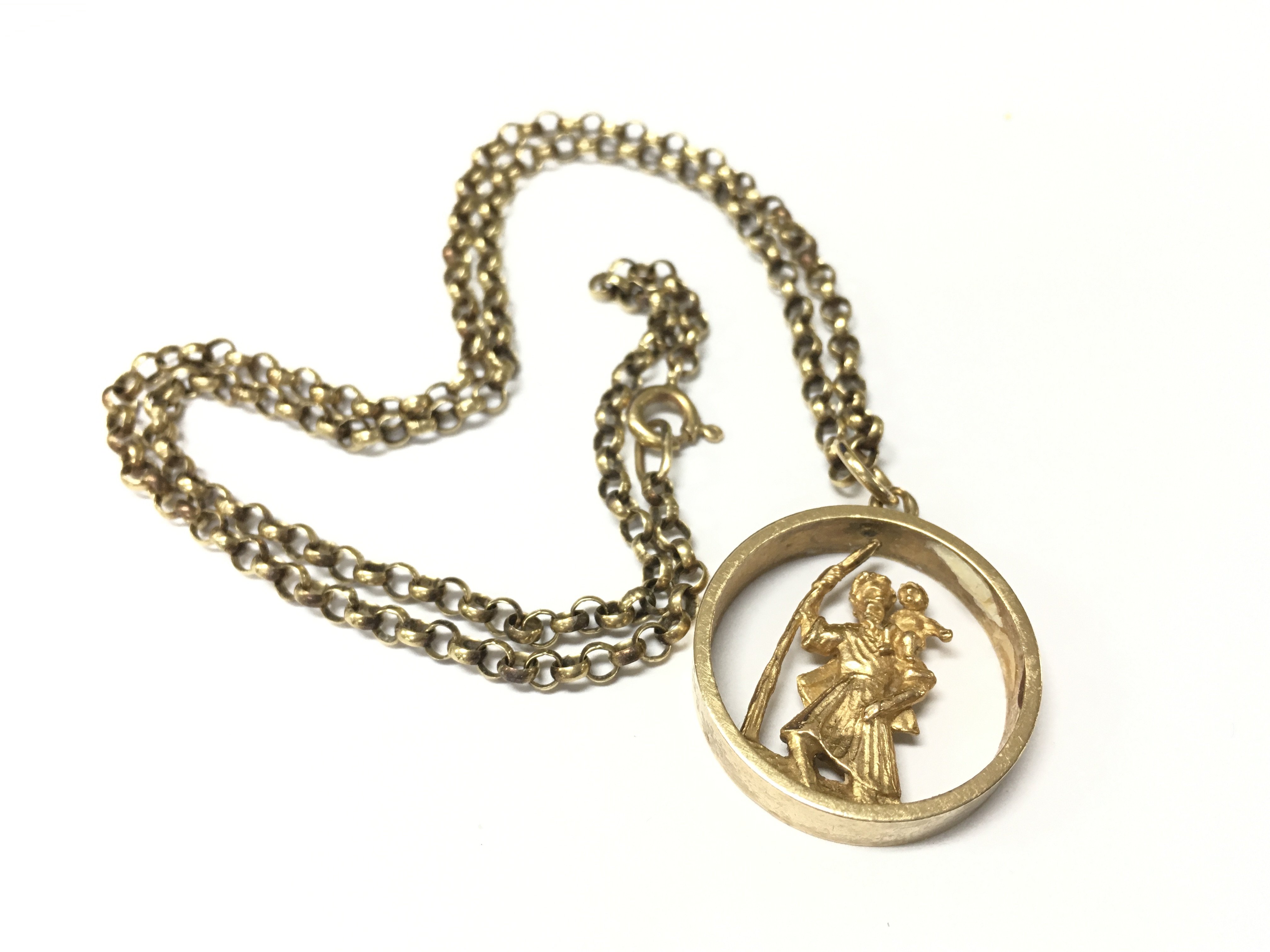 A 9ct gold st Christopher&#2013266057۪s pendant on a 9ct belcher chain. Approx weight 18.69 grams.