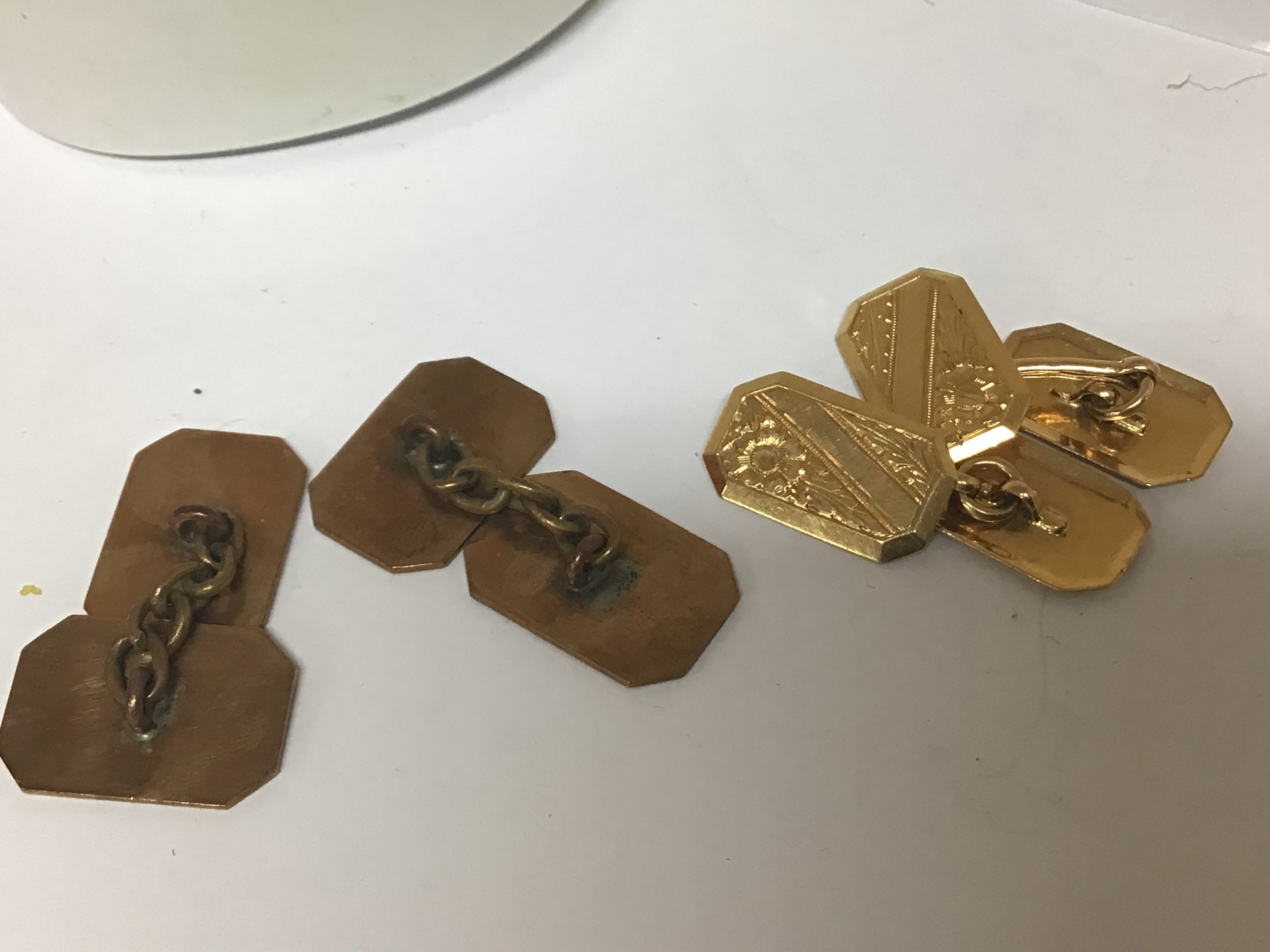 A pair of 18carat gold cufflinks weight 4g and one other pair of unmarked cufflinks.