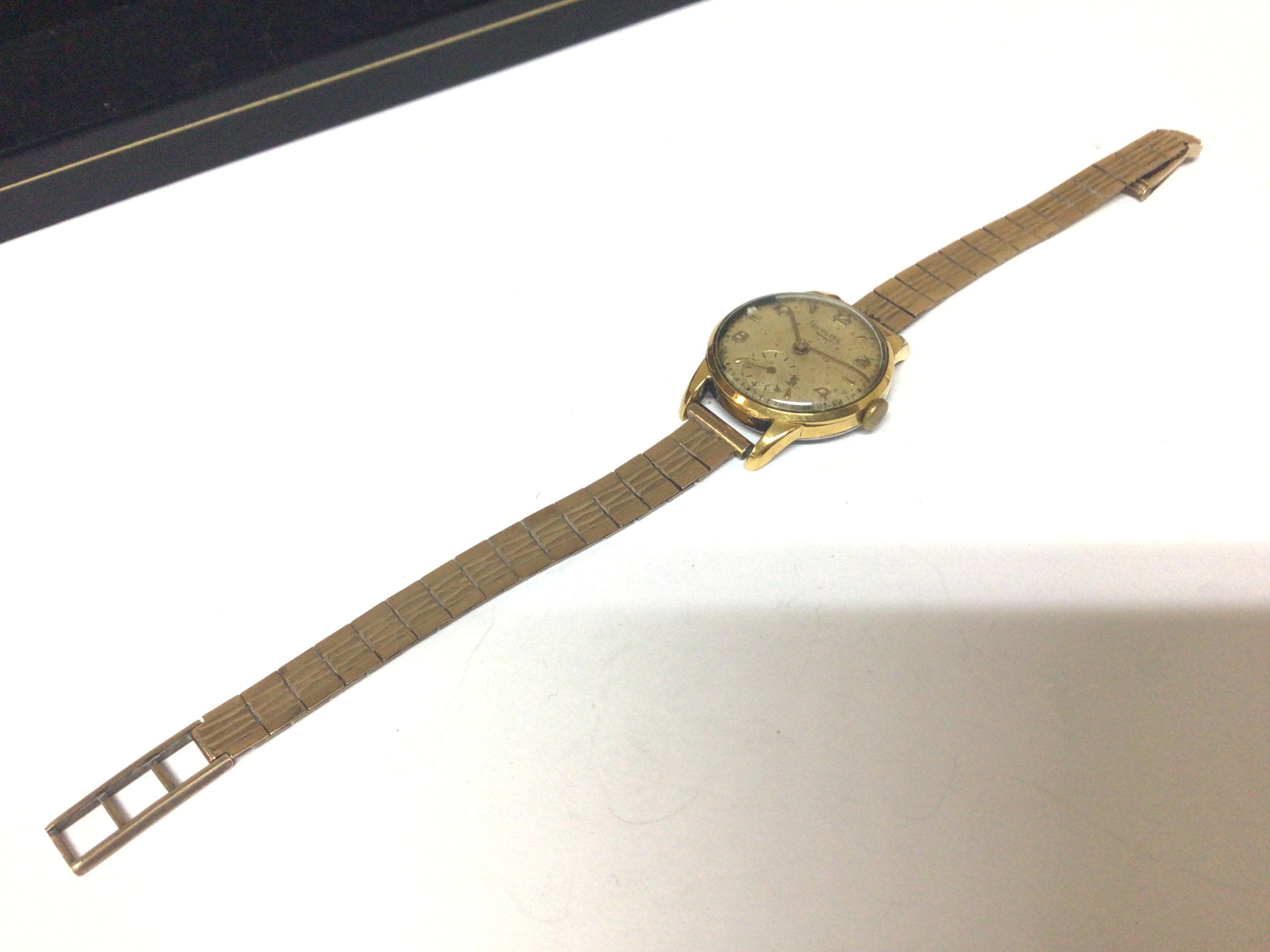 A Vintage ladies watch maker Levrette the watch with a steel back with a 9carat gold attached bracelet
