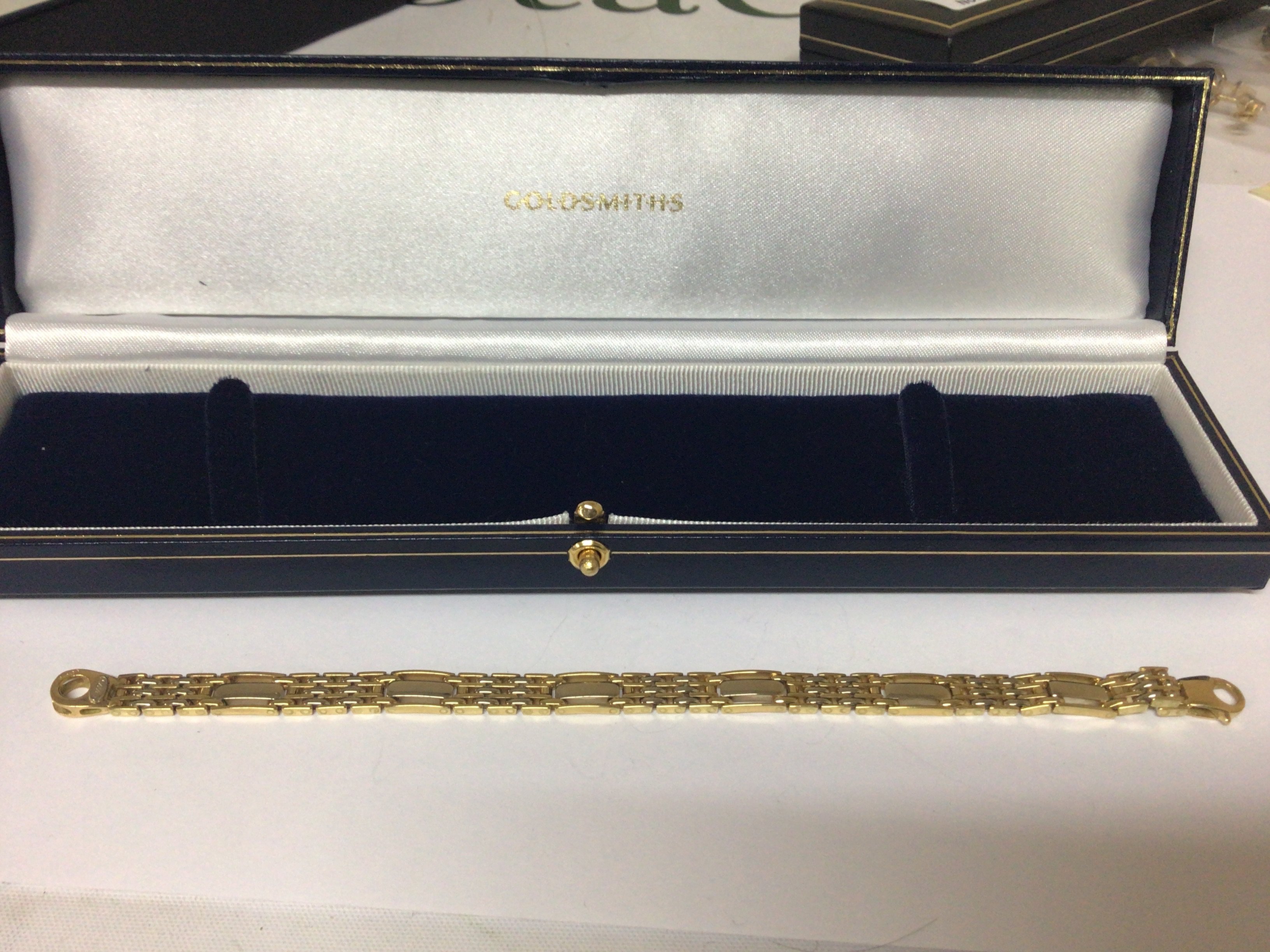 A quality Goldsmiths ladies 18carat gold multi link bracelet weight 23g in a fitted box.