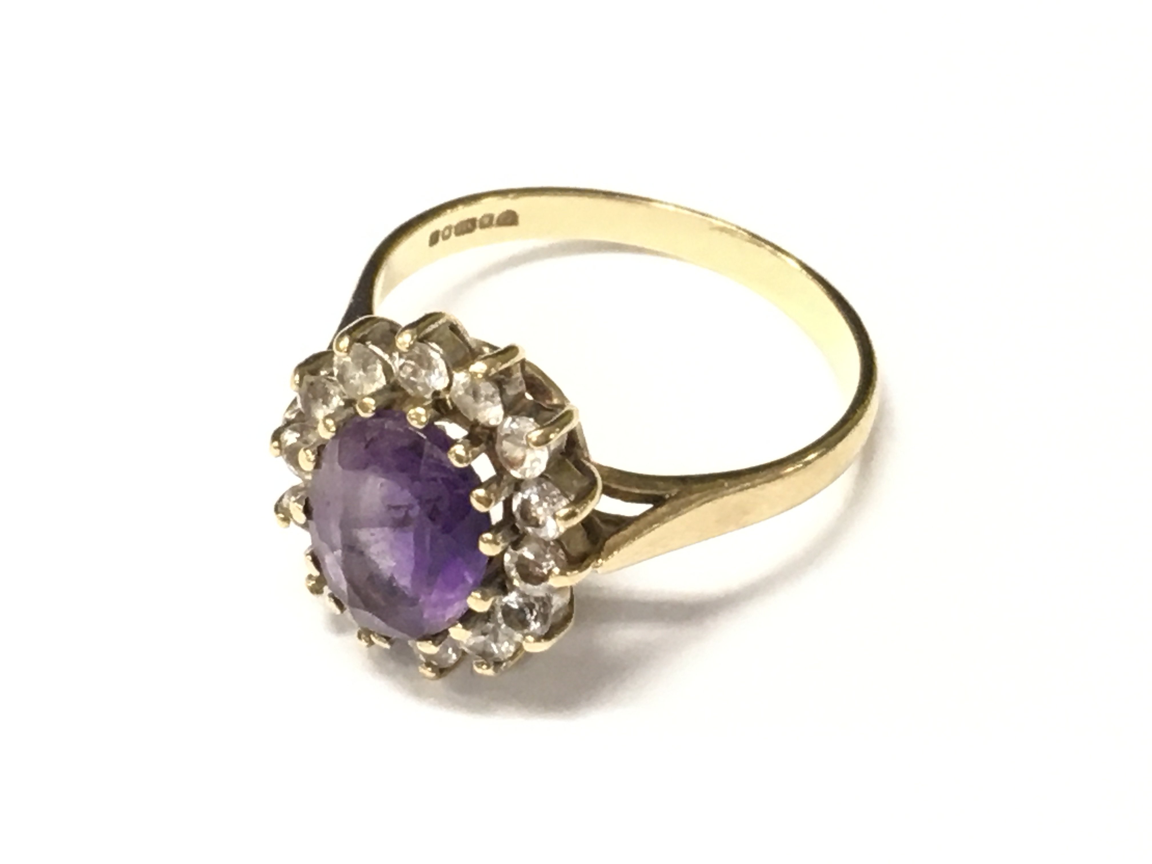 A laddies 9ct amethyst and diamond ring. Approx weight 3.42 grams.