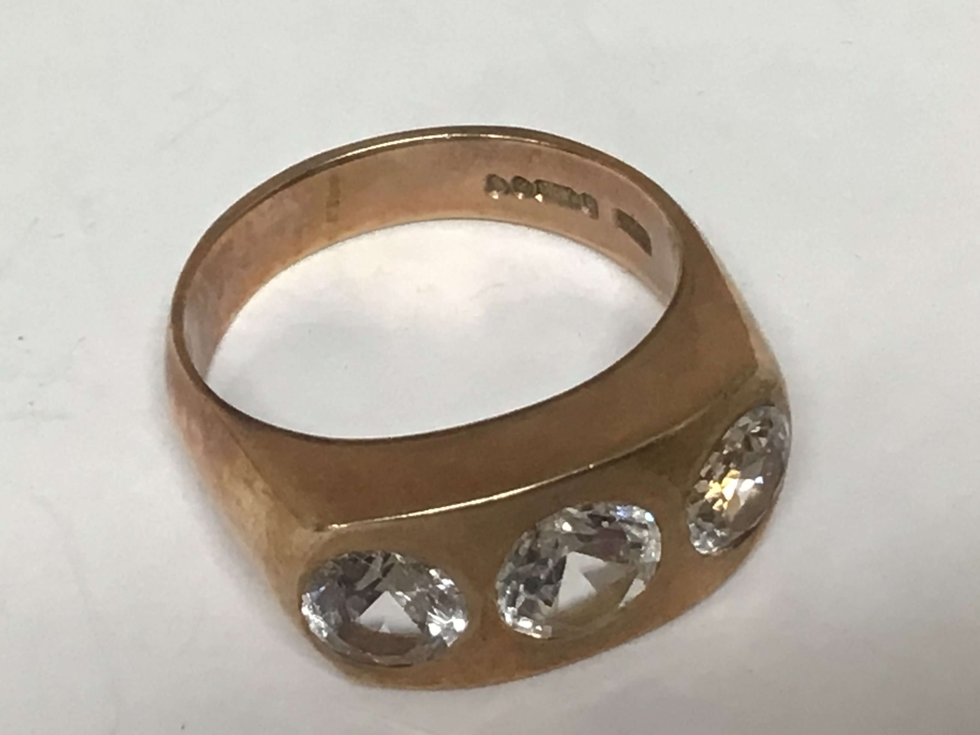 A gents ring 9carat gold ring set with CZ stones weight 10g