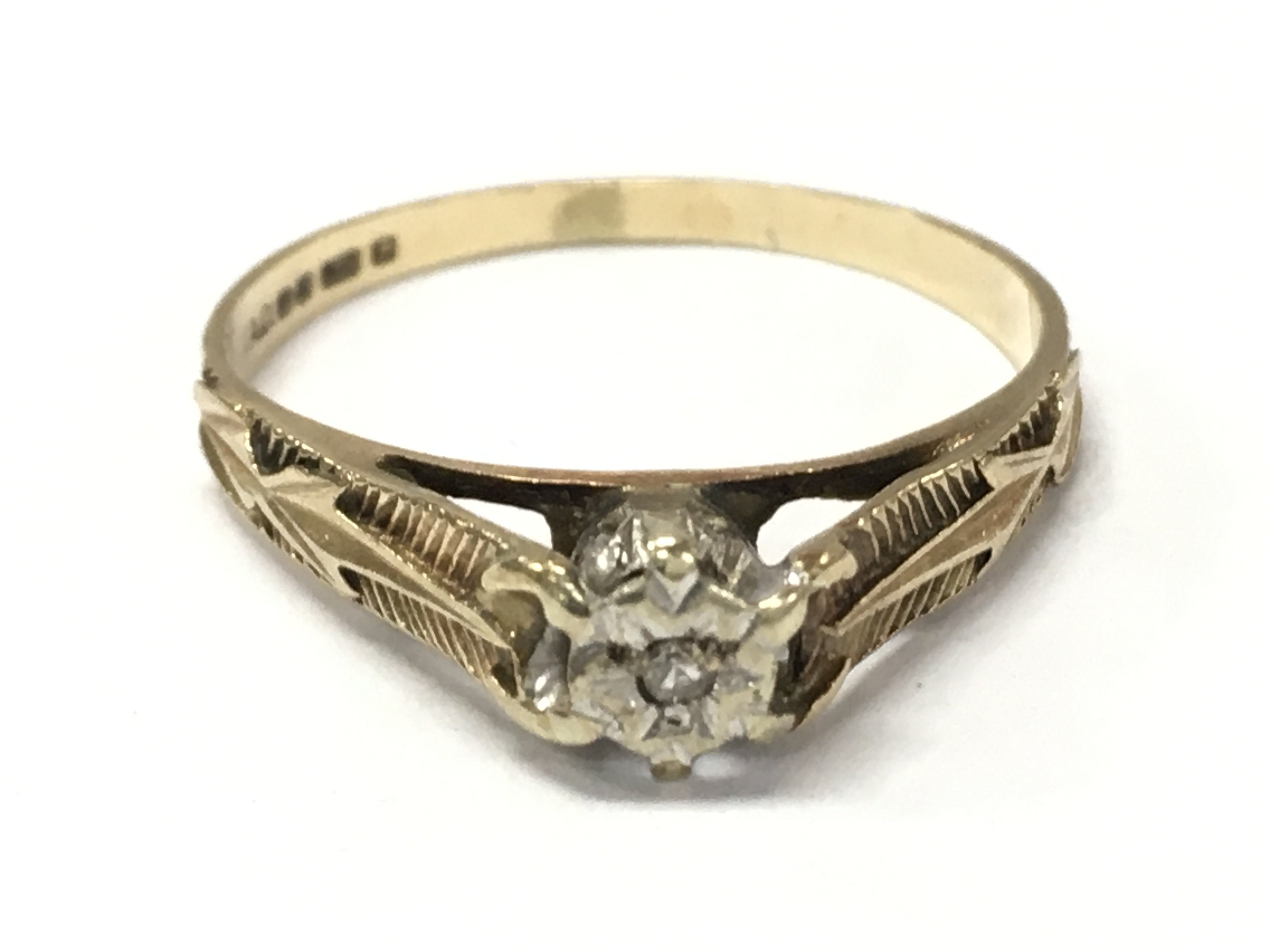 A 9ct gold ring set , size Q. Total weight 2g. Postage category a