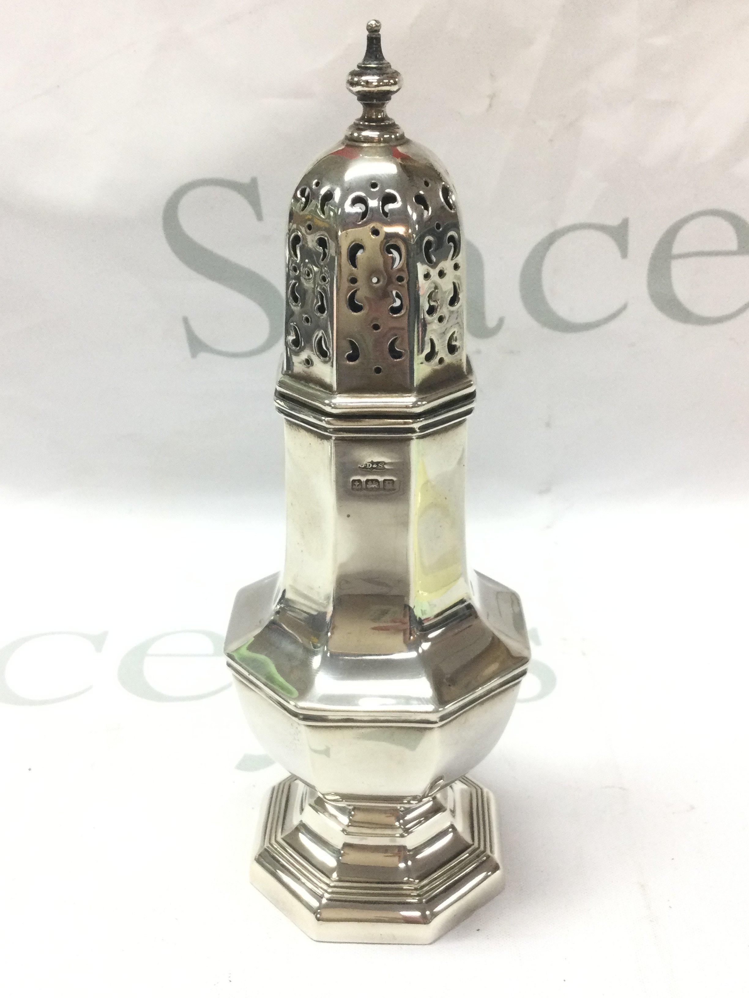 A silver hallmarked sugar sifter , 19cm tall. Postage category B