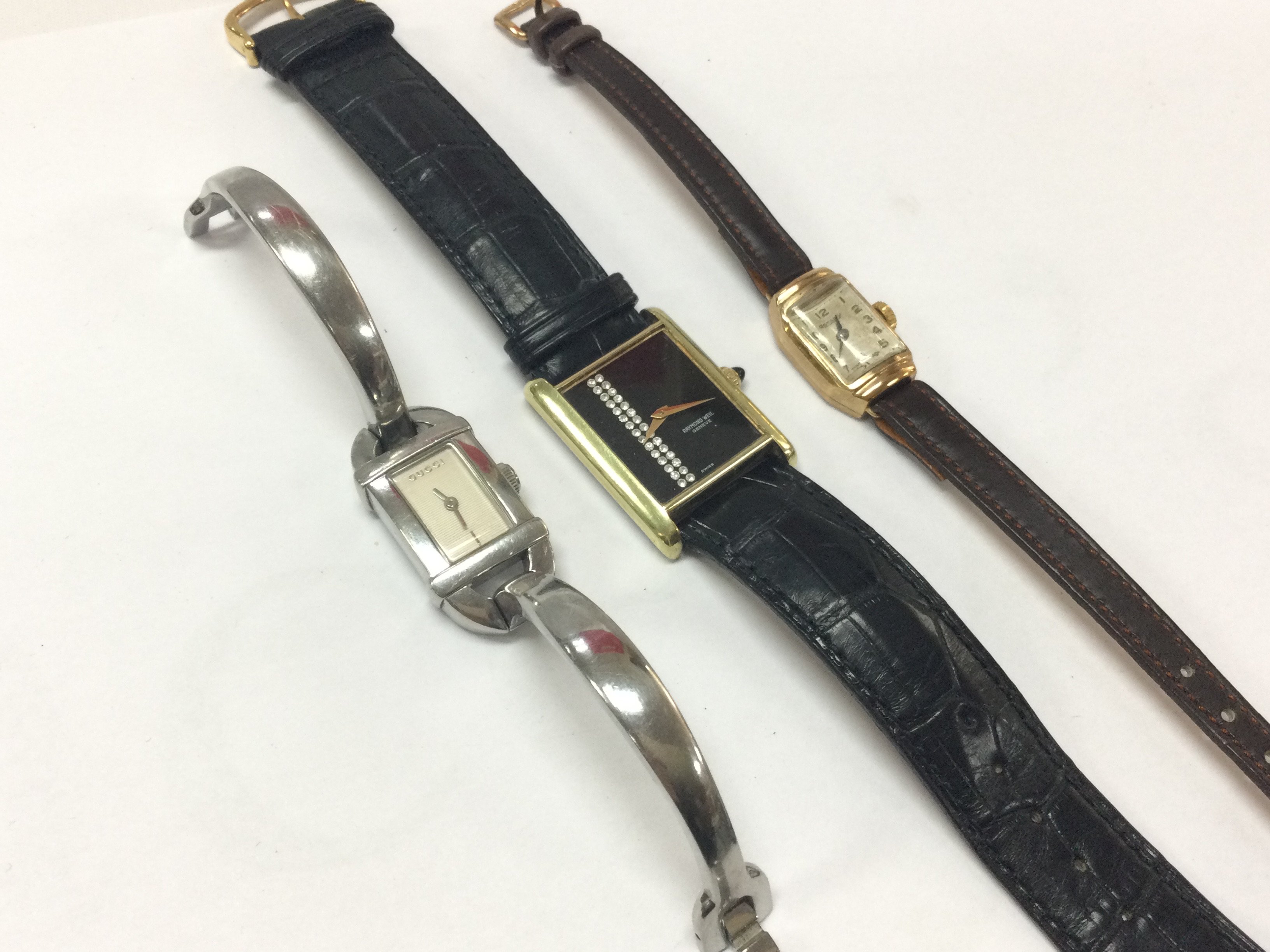 Three ladies watches including a 9 carat gold cased Rotary watch. Postage category A