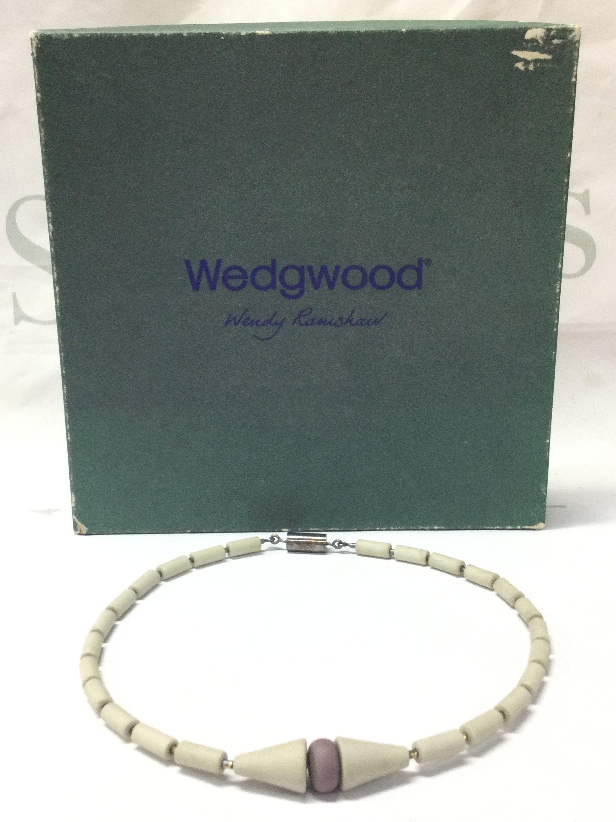 A boxed Wendy Ramshaw (1939-2018) necklace with Wedgwood hand turned beads ,a silver clasp hallmarked maker J.W and signed WR. 14cm wide approximately . Postage category B
