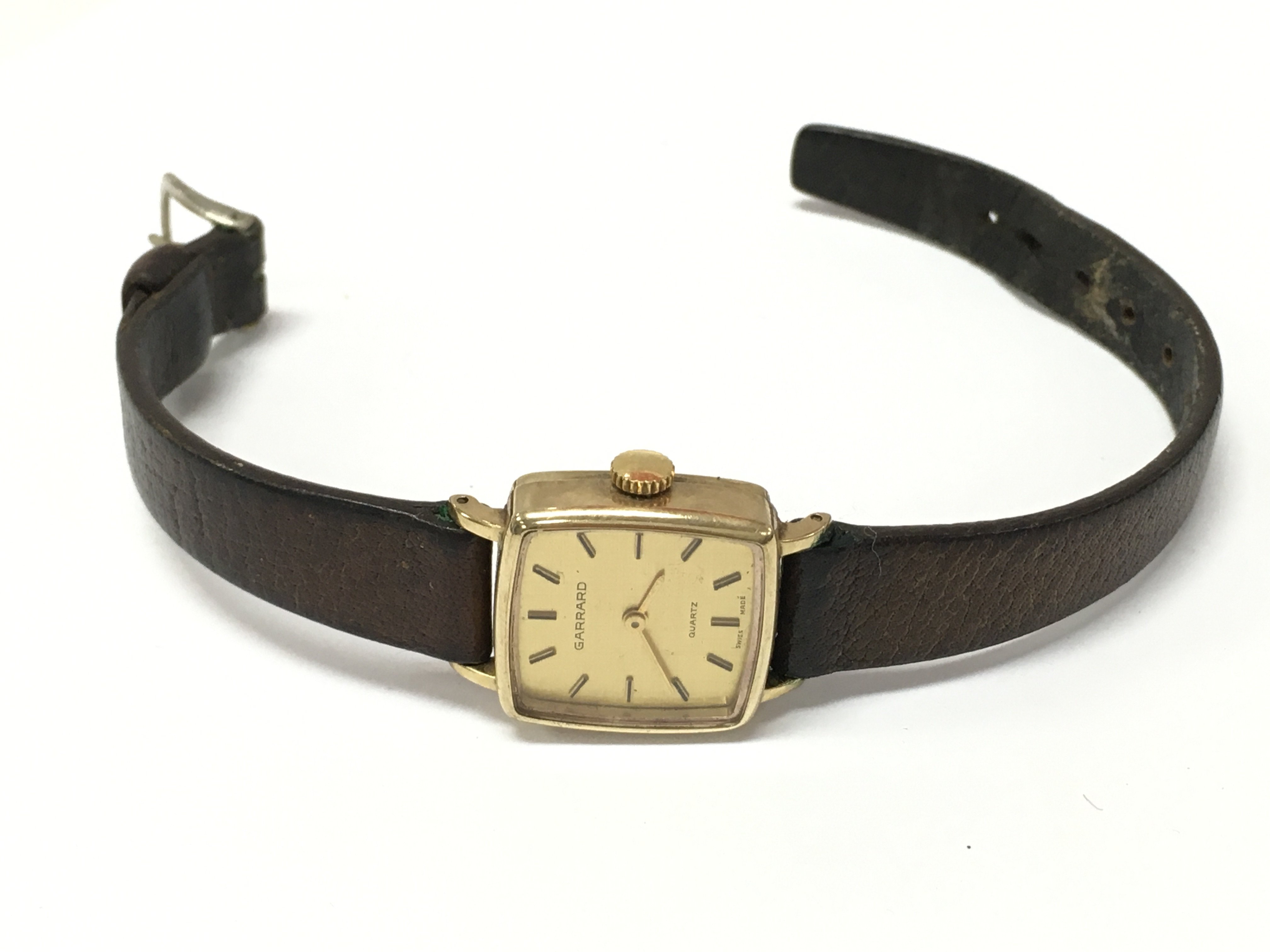 A 9 carat gold cased Garrard watch. Postage category A