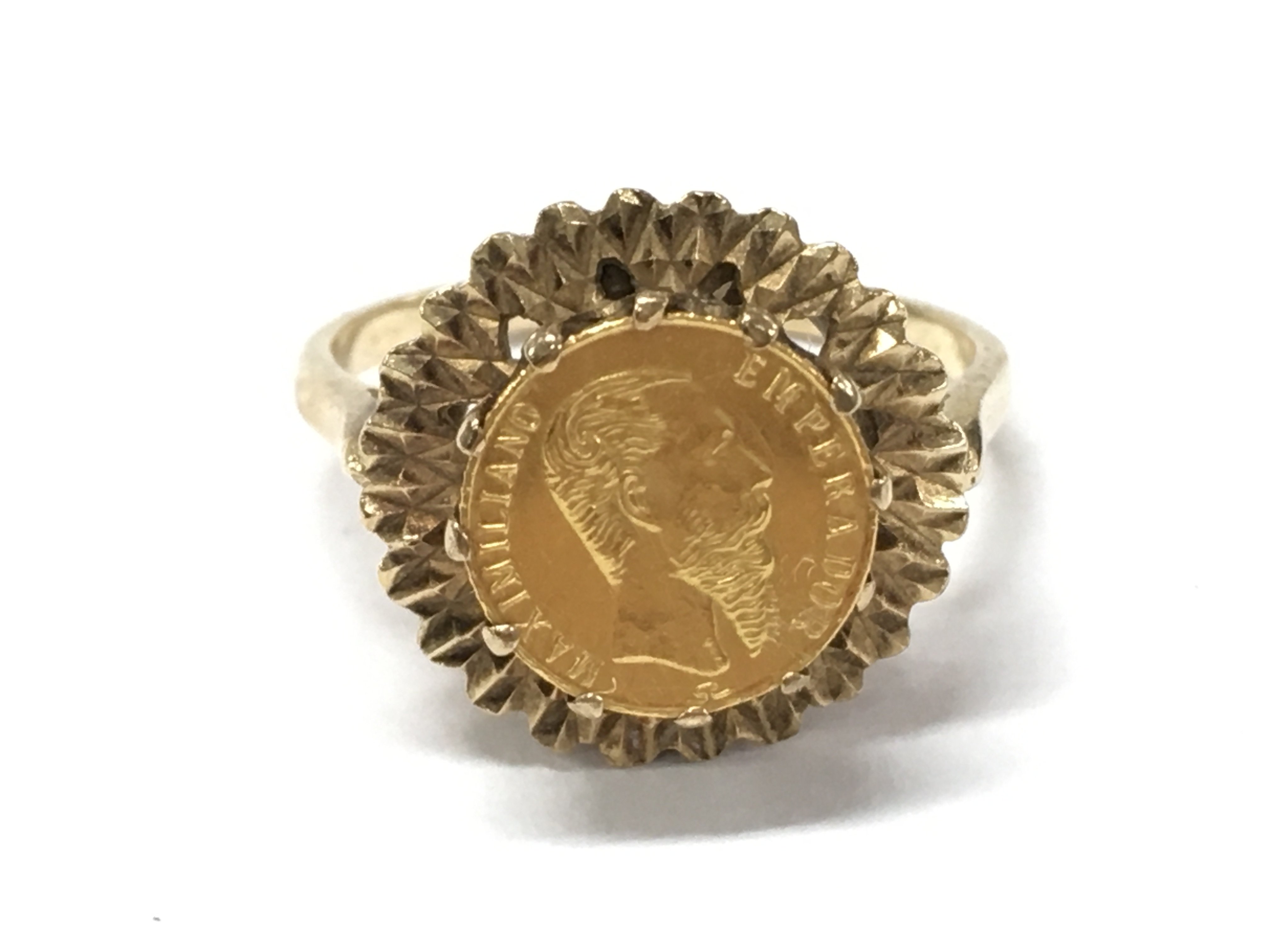 A 9ct gold ring set with a small Maximiliano Emperador coin. 3.6g total weight . Size P. Postage cat A