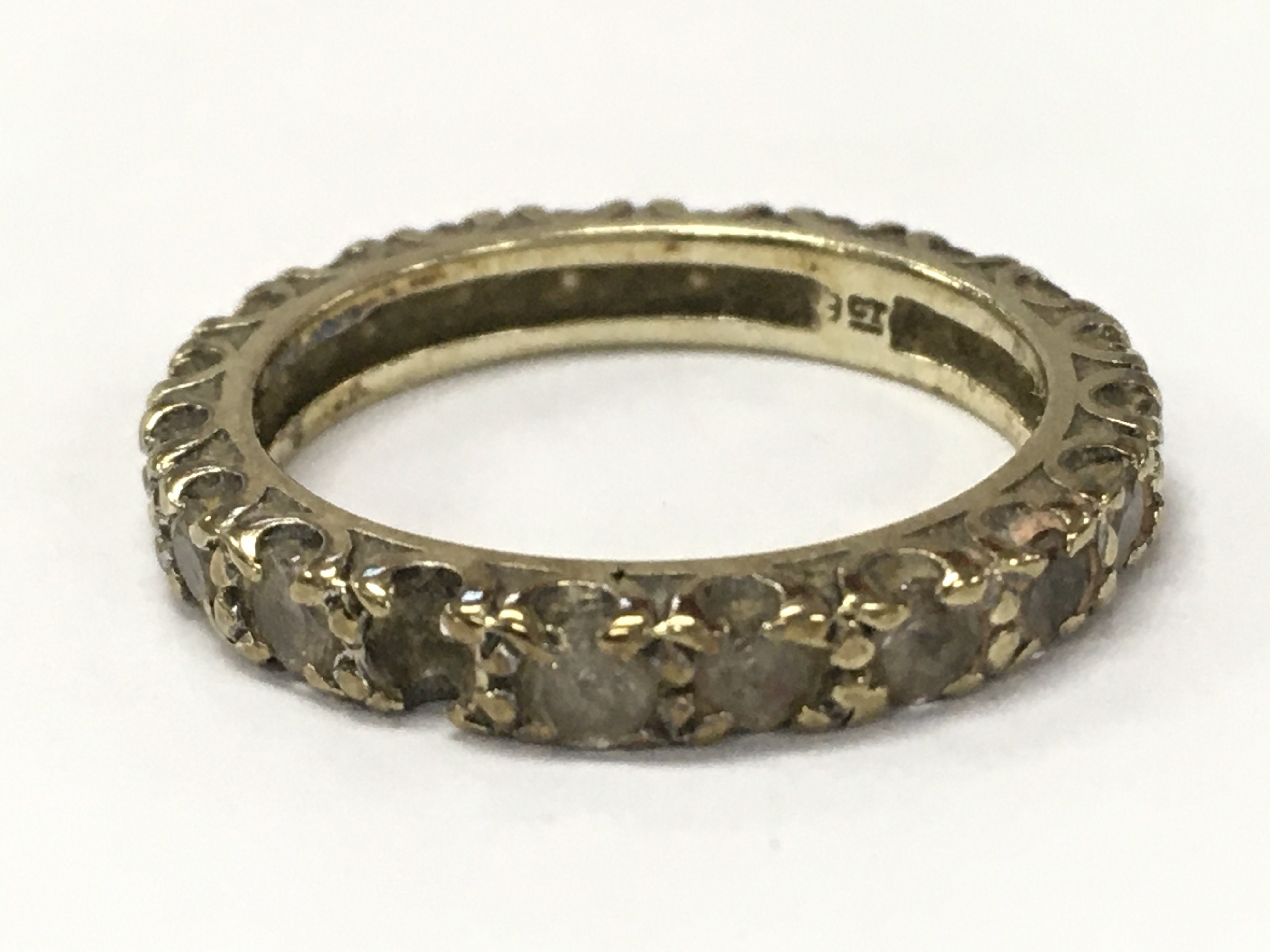 A 9 carat gold gents eternity ring. Size N. 3.1g total weight. Postage category A