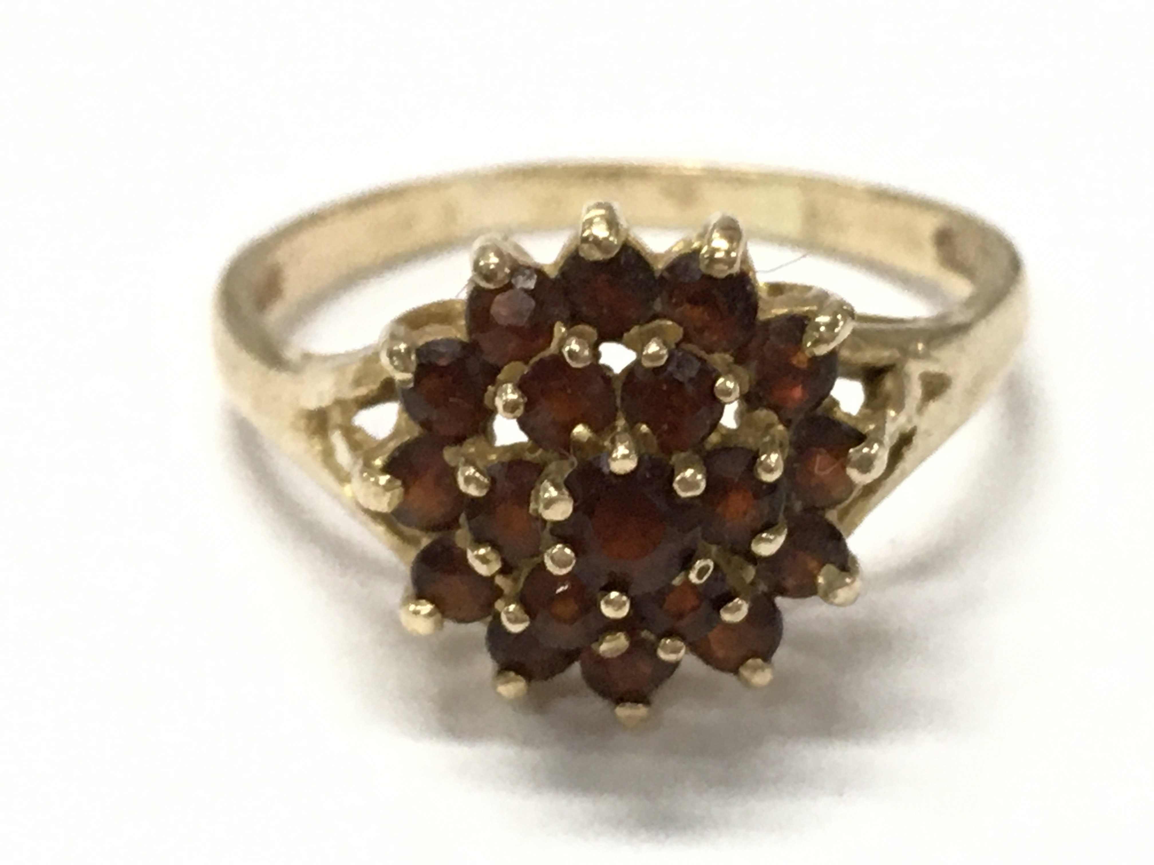 A 9ct gold ring set with garnets , size R. 3.3G total weight. Postage category A