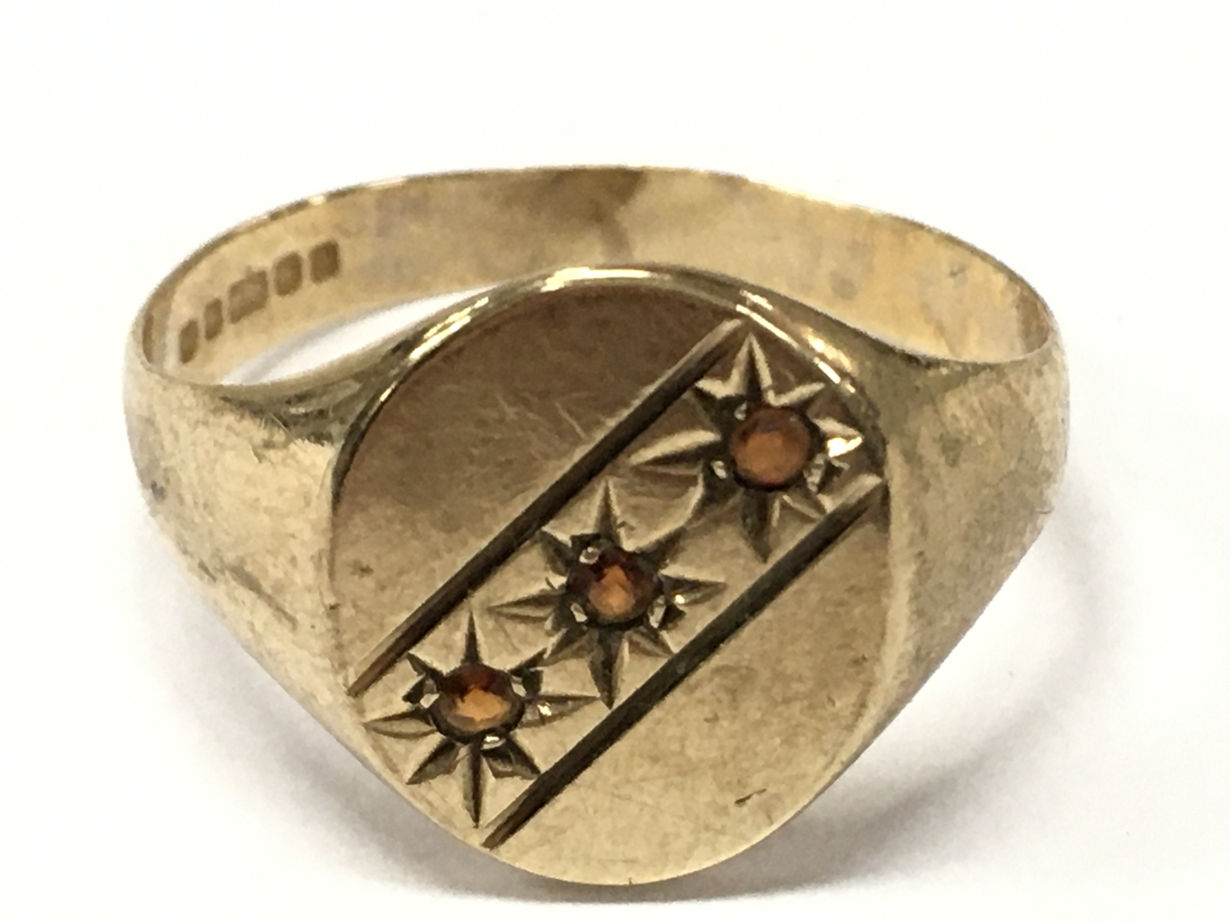 A 9 carat gold garnet signet ring , size Q. 2.2g total weight. Postage category A