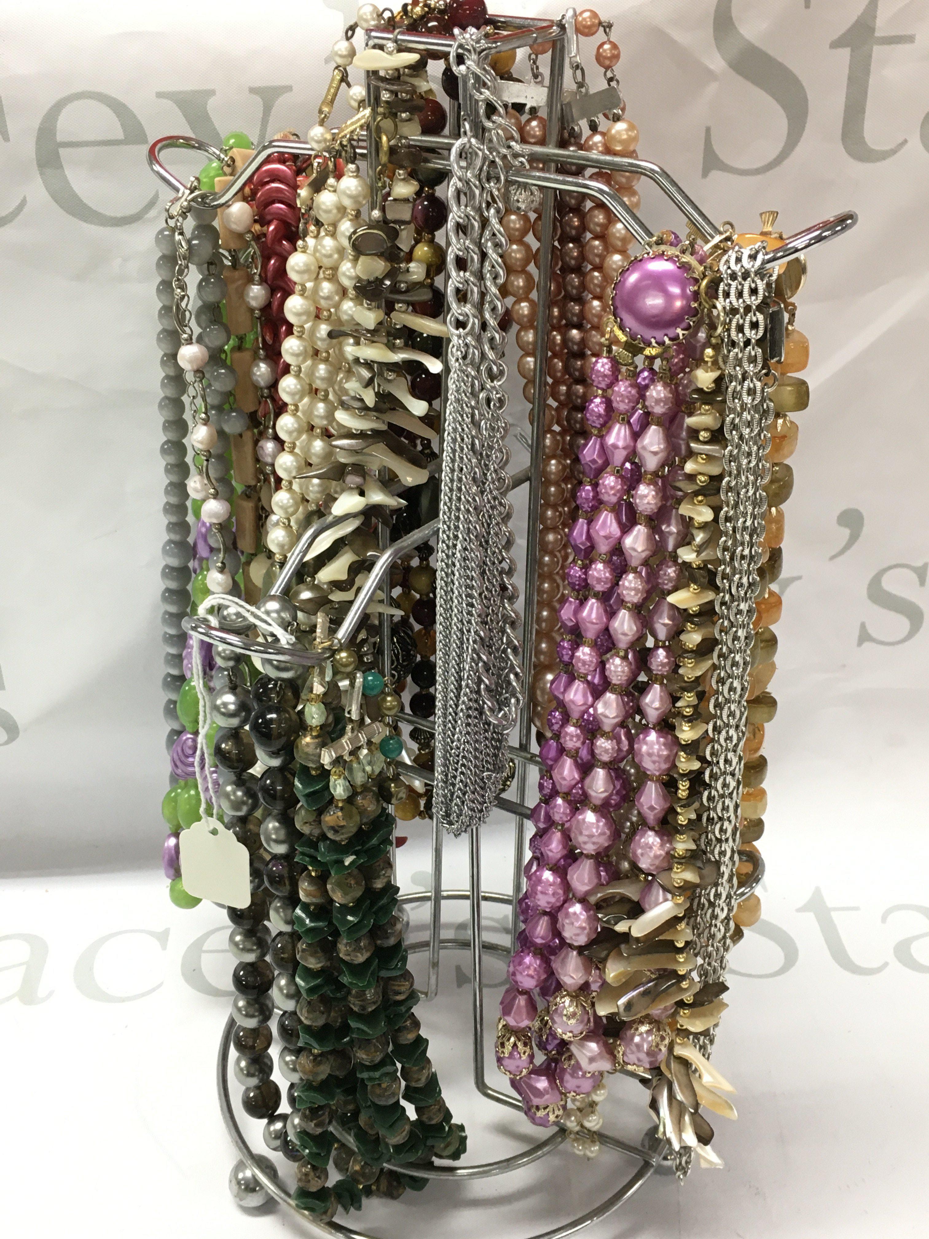 Approximately 15 70s/80s costume jewellery necklaces . Postage category B