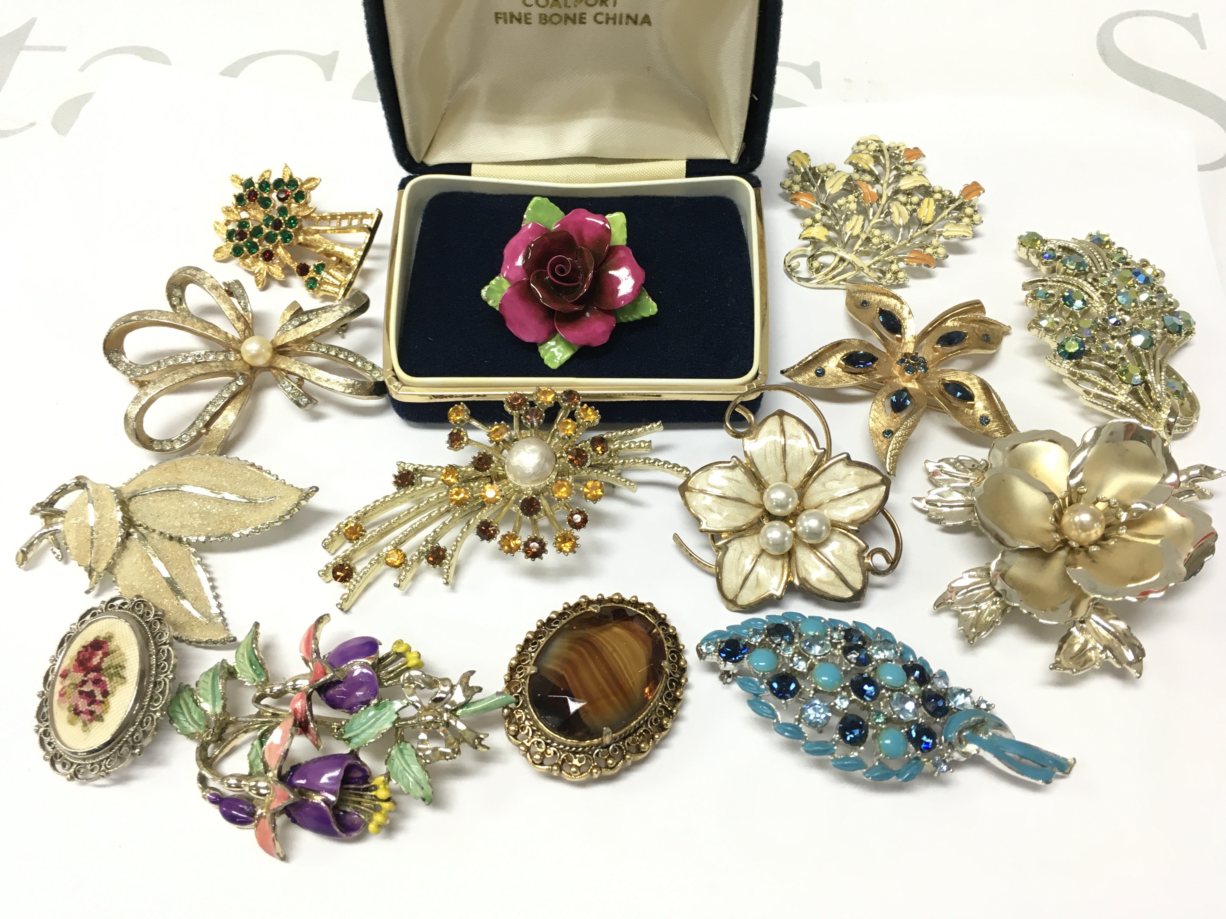 A Collection of various 20th century brooches including a boxed Coalport rose brooch . Postage catA