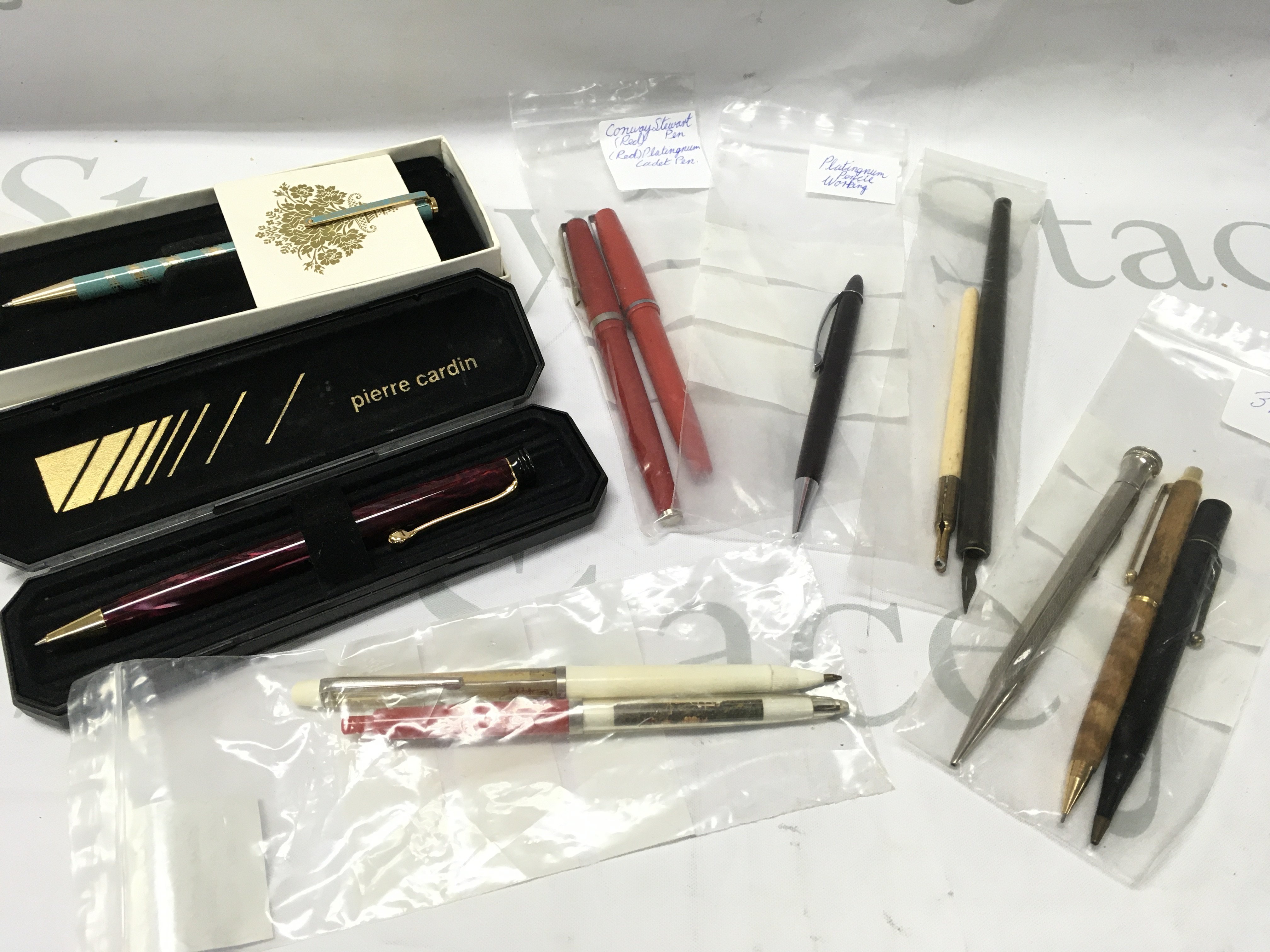 A Collection of pens including Buckingham palace biro, Pierre Cardin biro, dipping pens etc . Postage category B