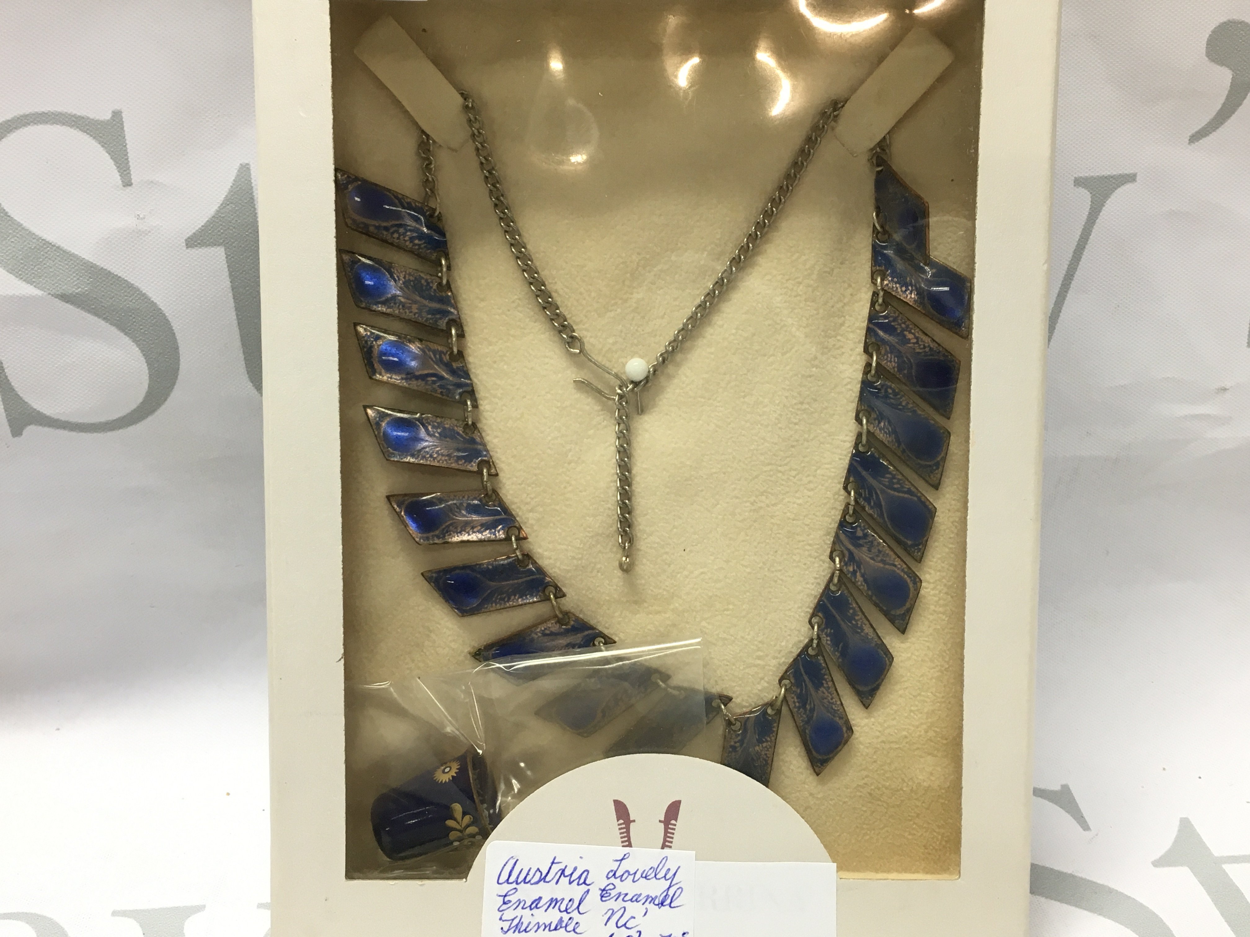 An Austrian enamel thimble and enamel necklace