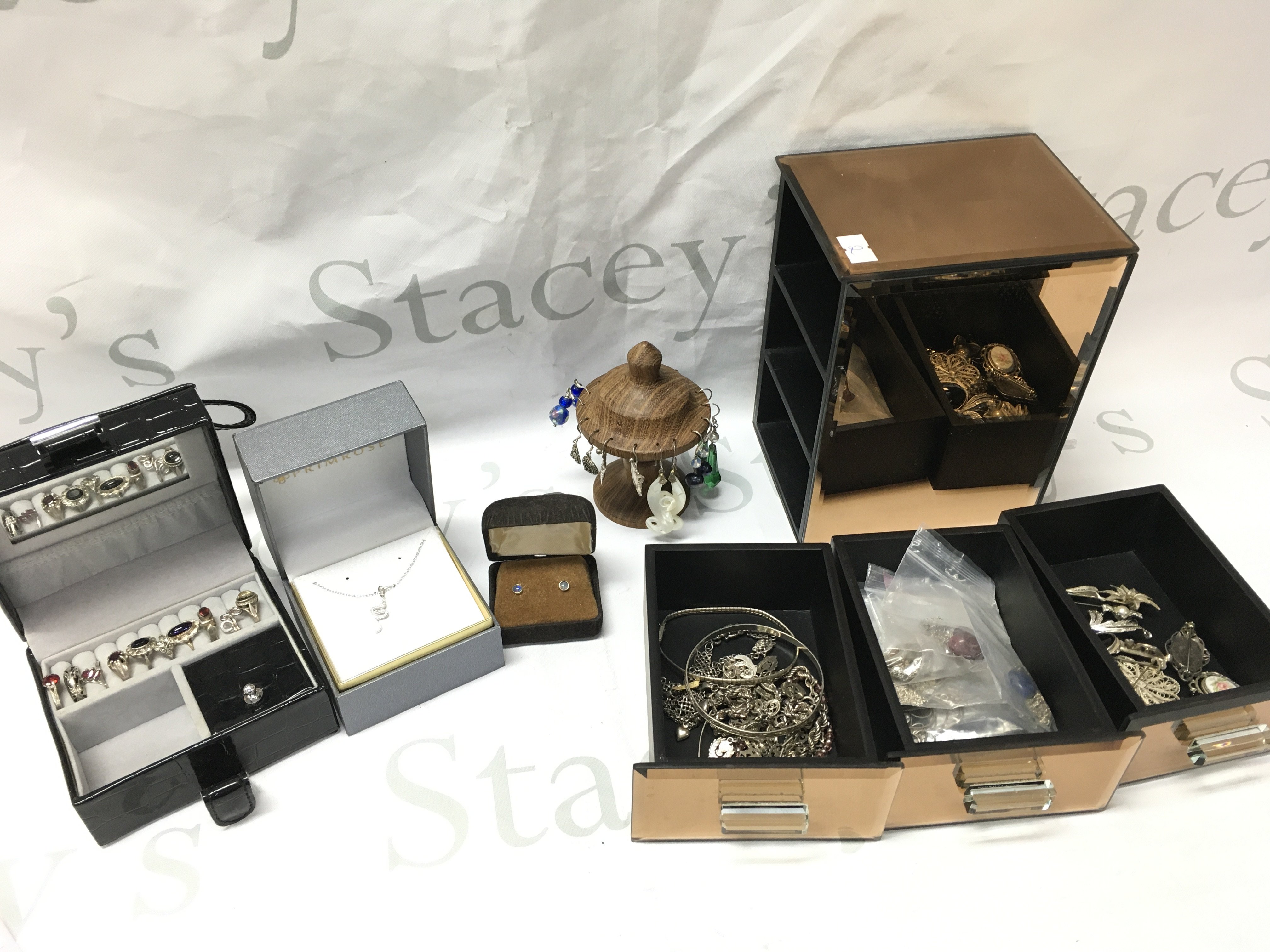 A Collection of mostly silver jewellery including rings, earrings, brooches etc . Postage category B