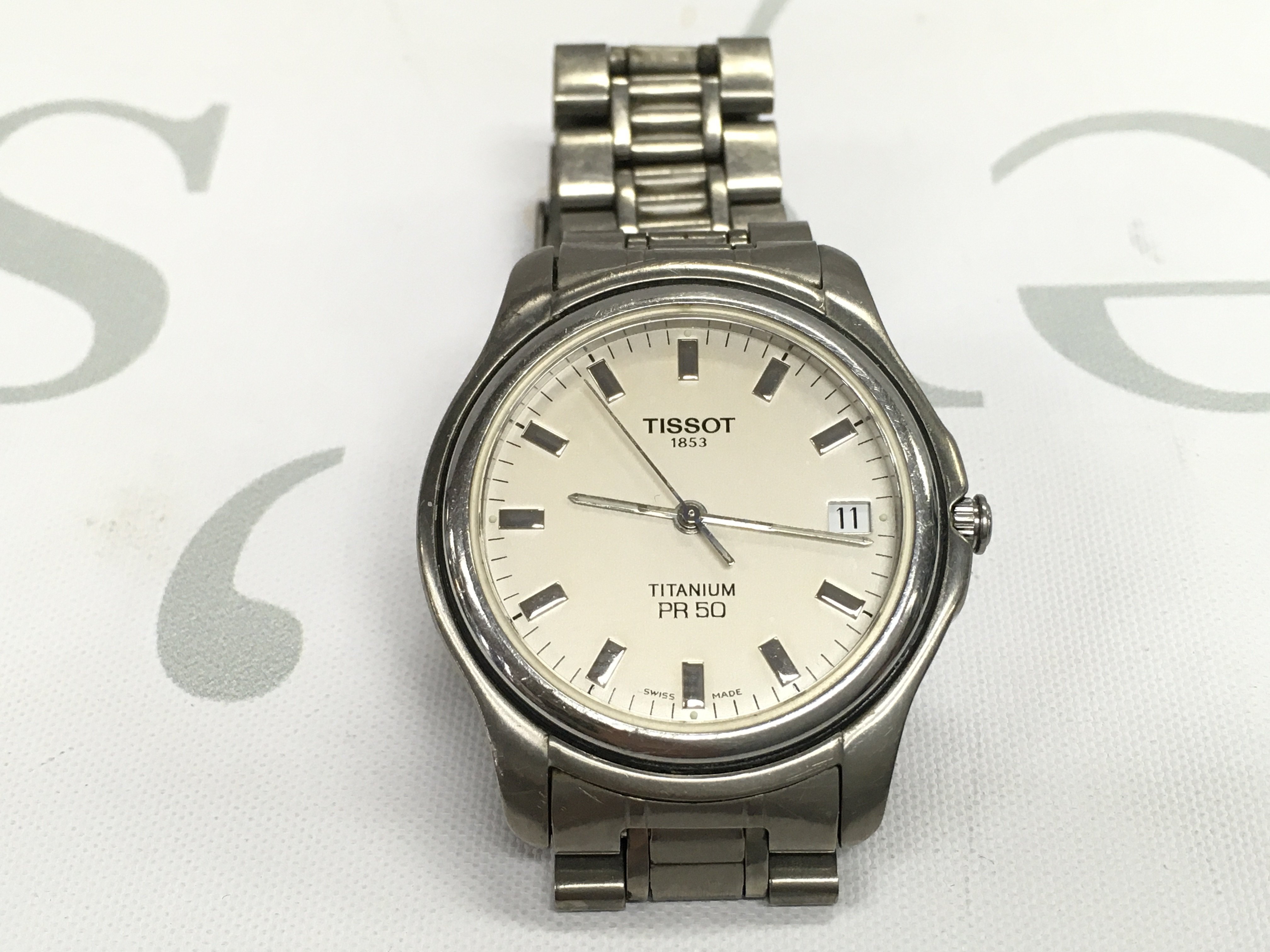 A vintage mens Tissot Titanium PR50. Seen running.
